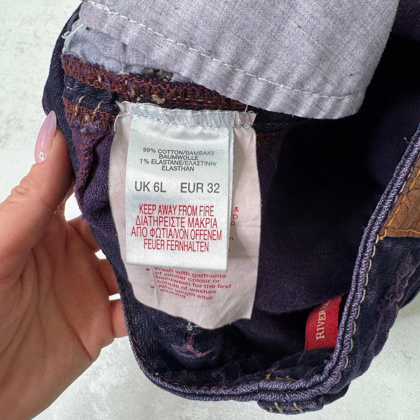 Y2K vintage low rise bootcut denim jeans stretchy purple faded wash fraying hem