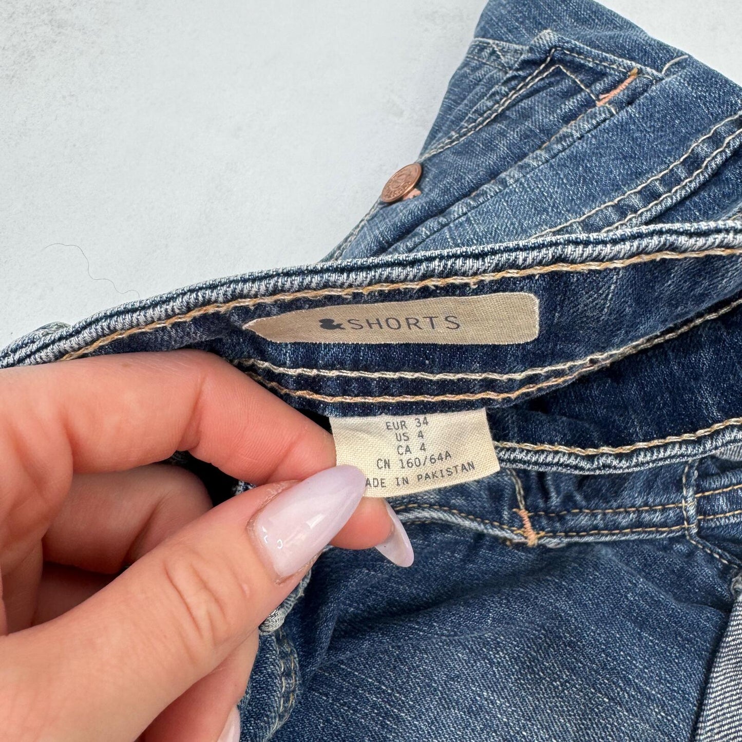 Y2K vintage low rise denim mini shorts cargo turn up hem faded blue stretchy