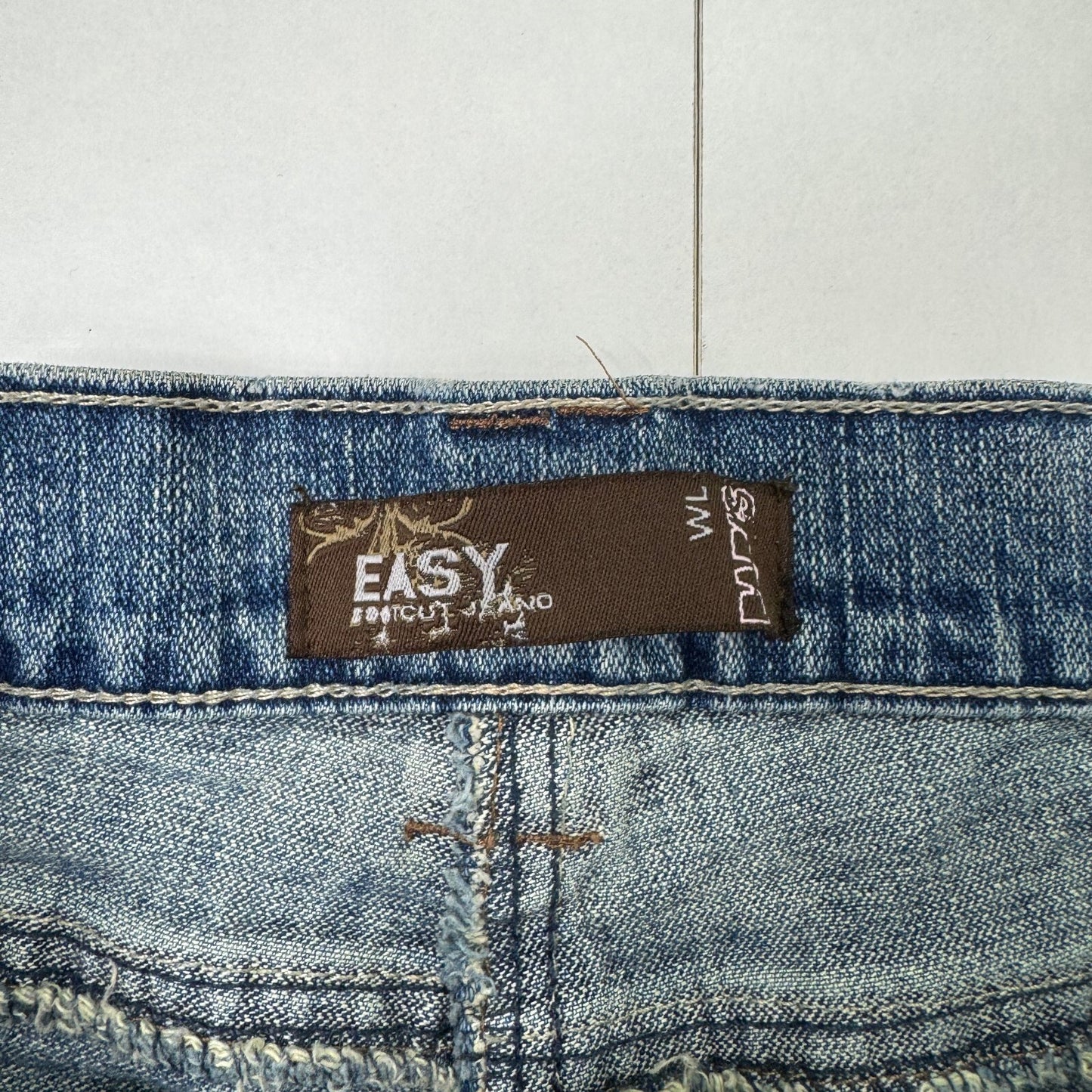 Y2K vintage bootcut denim jeans stretchy faded mid blue distressed
