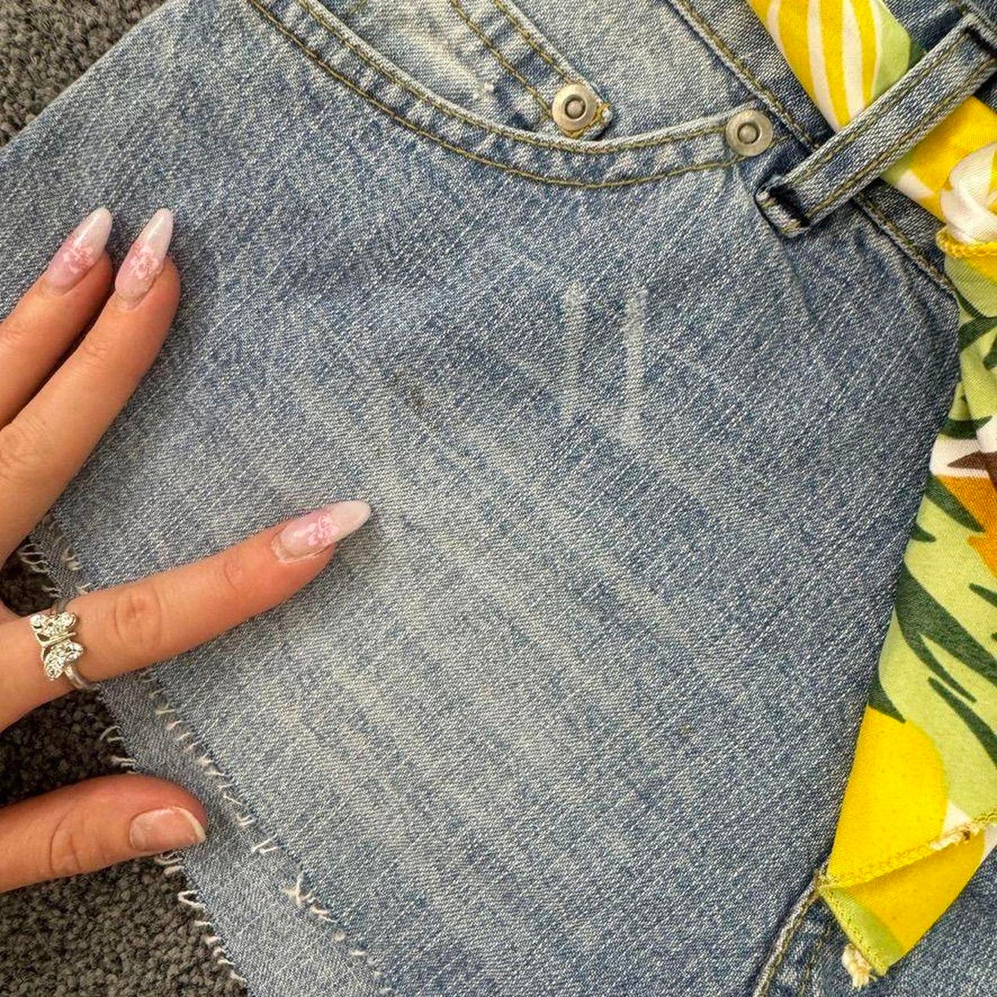 Y2K vintage low rise raw hem mini denim shorts with sunflower bow belt