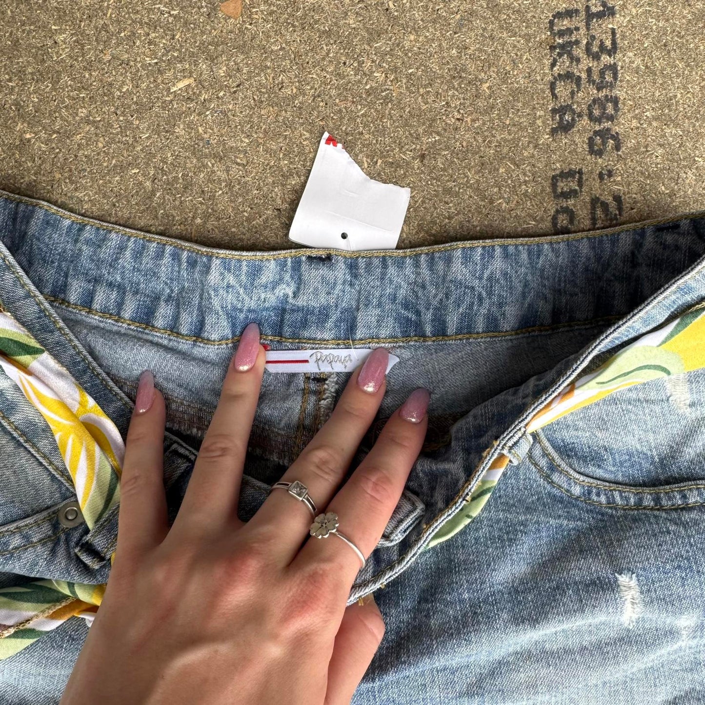 Y2K vintage low rise raw hem mini denim shorts with sunflower bow belt