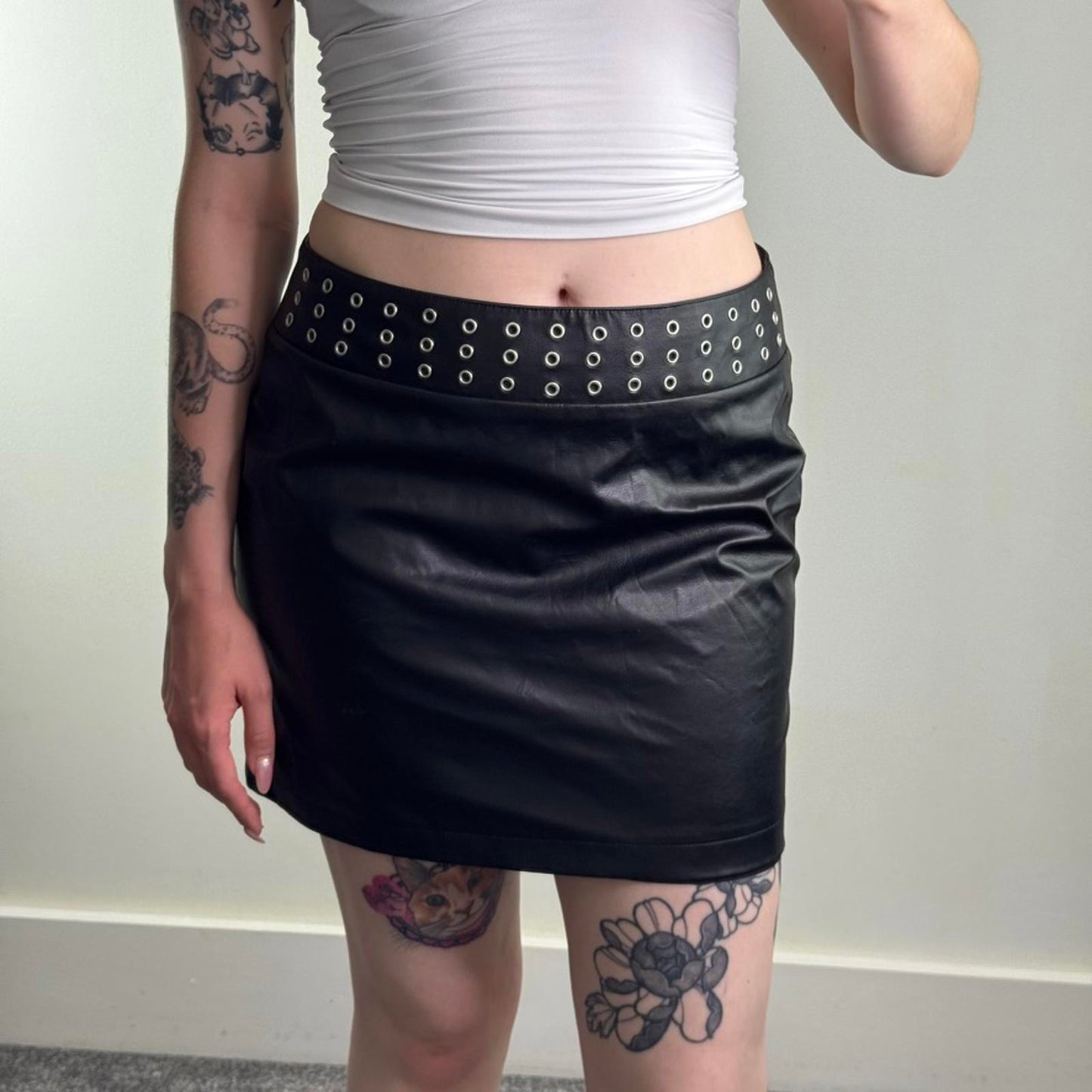 Y2K vintage faux leather studded mini skirt grommet eyelet mid rise alt emo goth