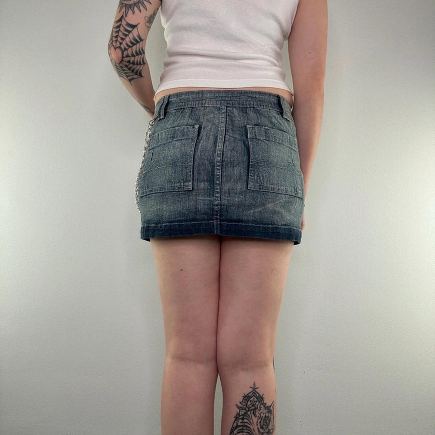 Y2K vintage faded denim mini skirt with faux pearl bead chain low rise