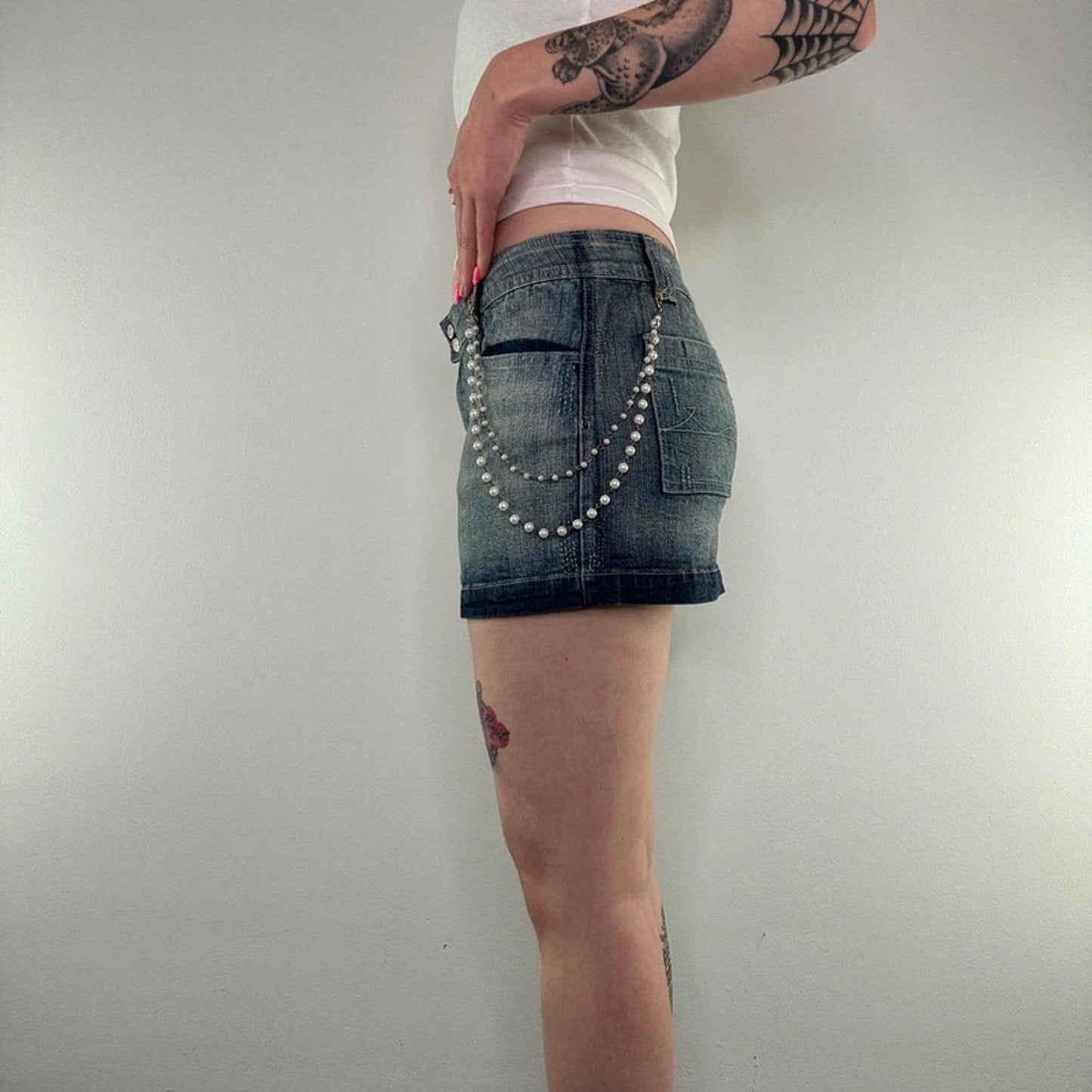 Y2K vintage faded denim mini skirt with faux pearl bead chain low rise
