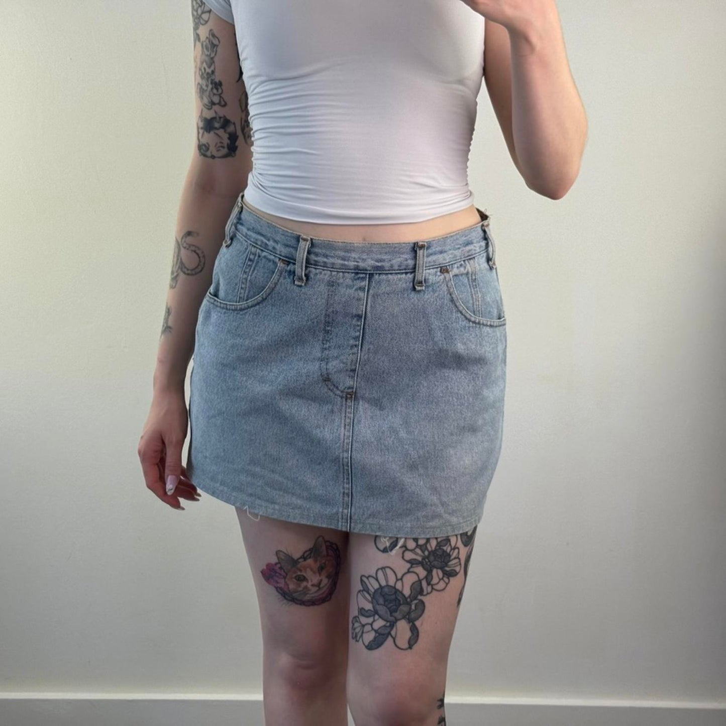 90s Y2K vintage denim mini skirt zipper fraying hem light blue wash mid rise