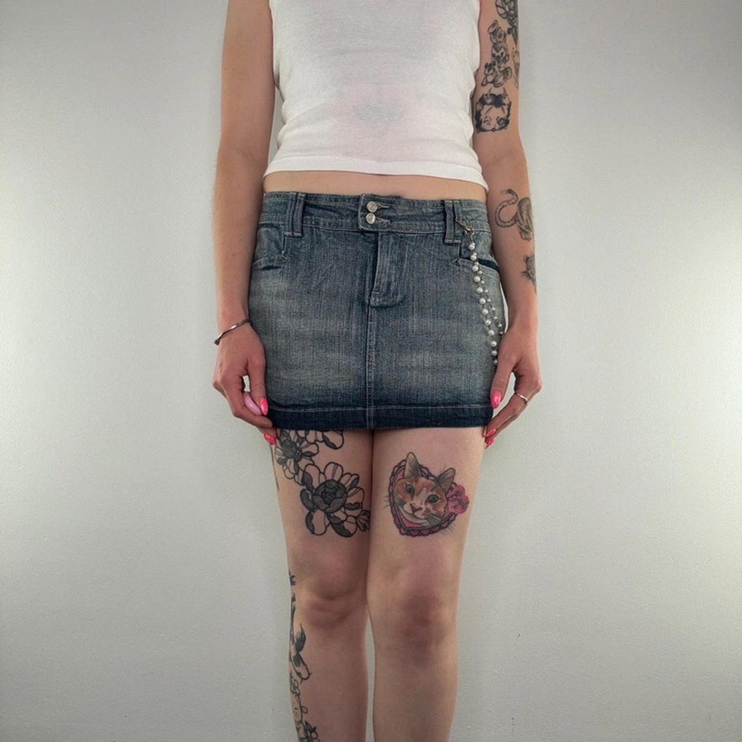 Y2K vintage faded denim mini skirt with faux pearl bead chain low rise