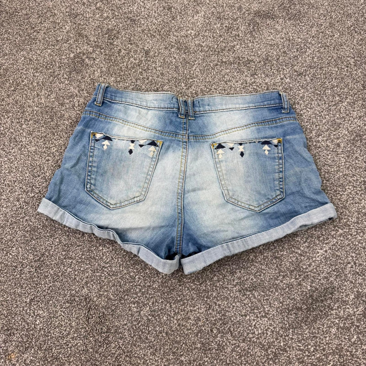 Y2K vintage low rise faded denim mini shorts embroidered aztec 2010s turned hem