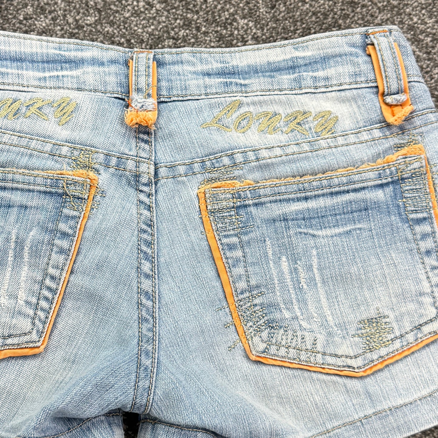 Y2K vintage low rise shorts light denim distressed mini orange contrast stitch