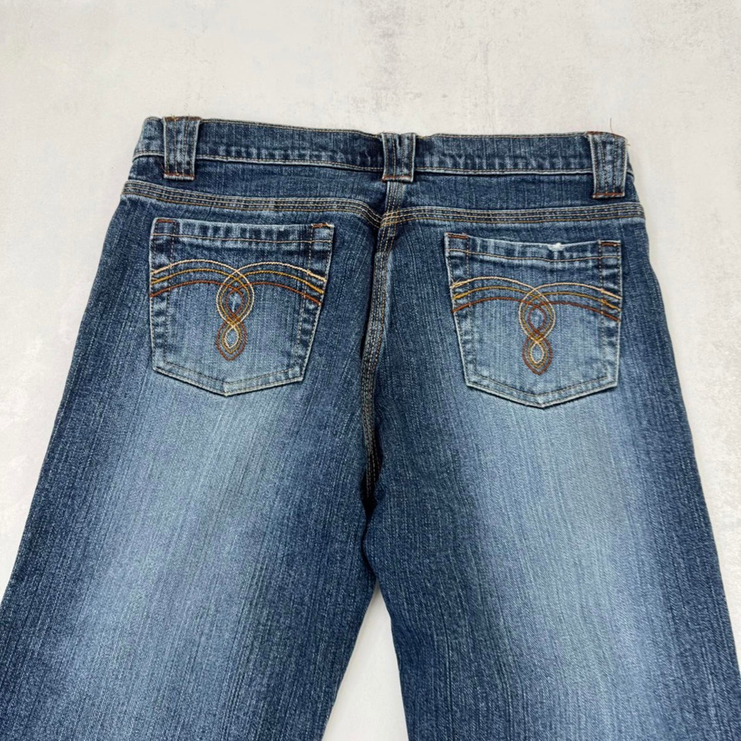 Y2K vintage bootcut denim jeans mid rise stretchy faded mid blue wash