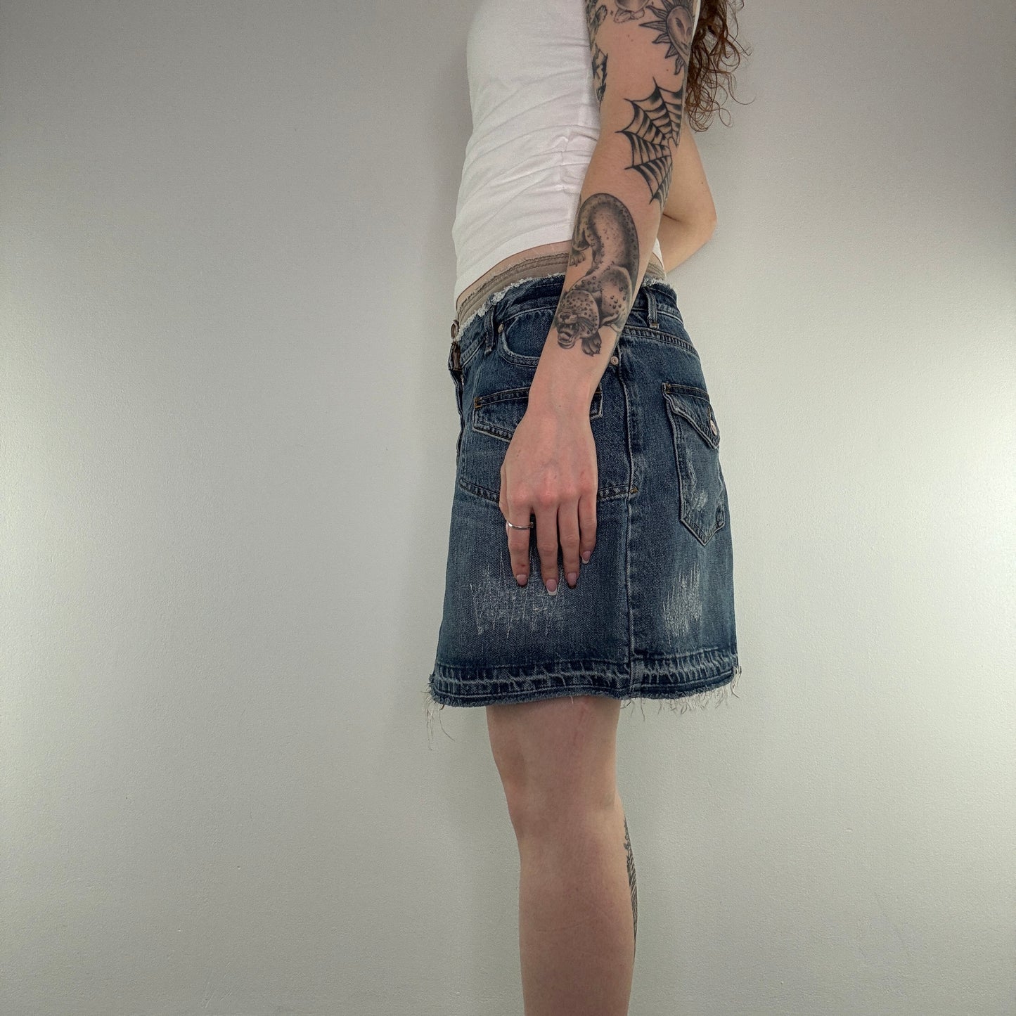 Y2K distressed fraying hem cargo denim mini skirt