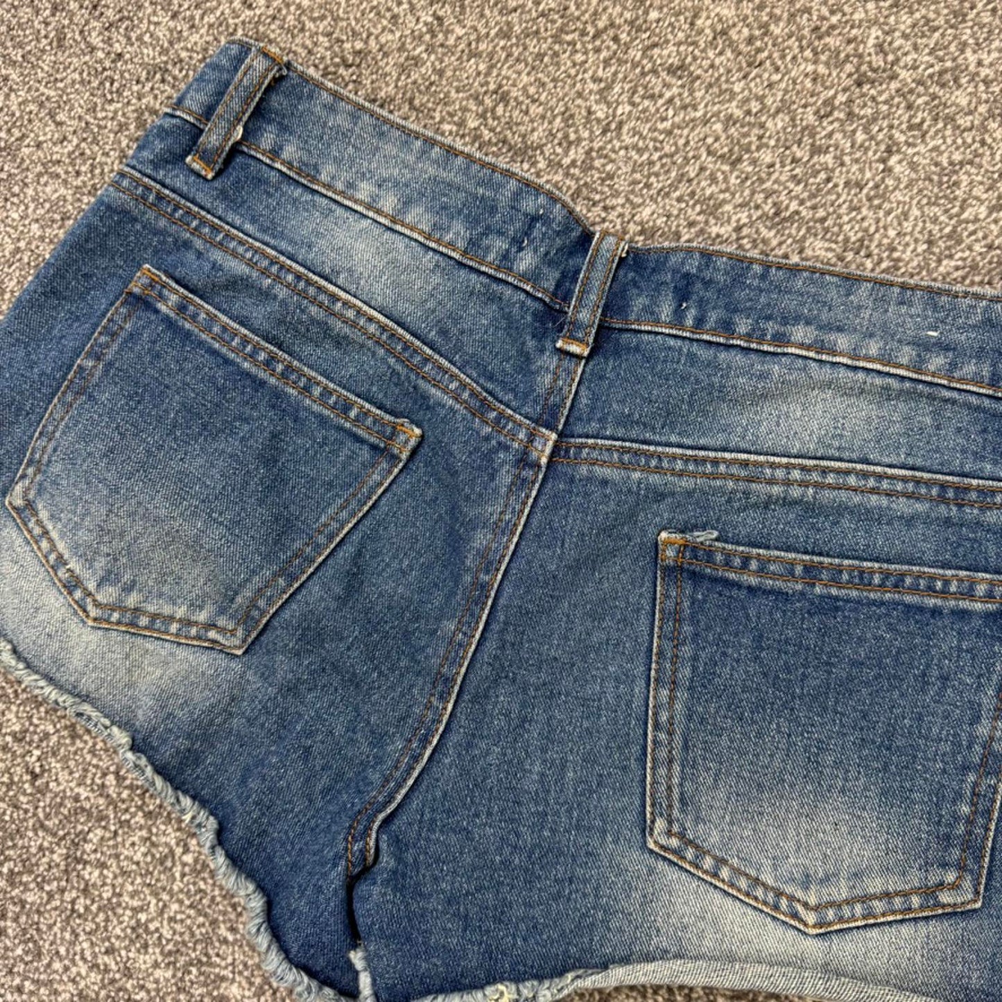 Y2K vintage mid rise denim mini shorts distressed ripped faded fraying hem stars