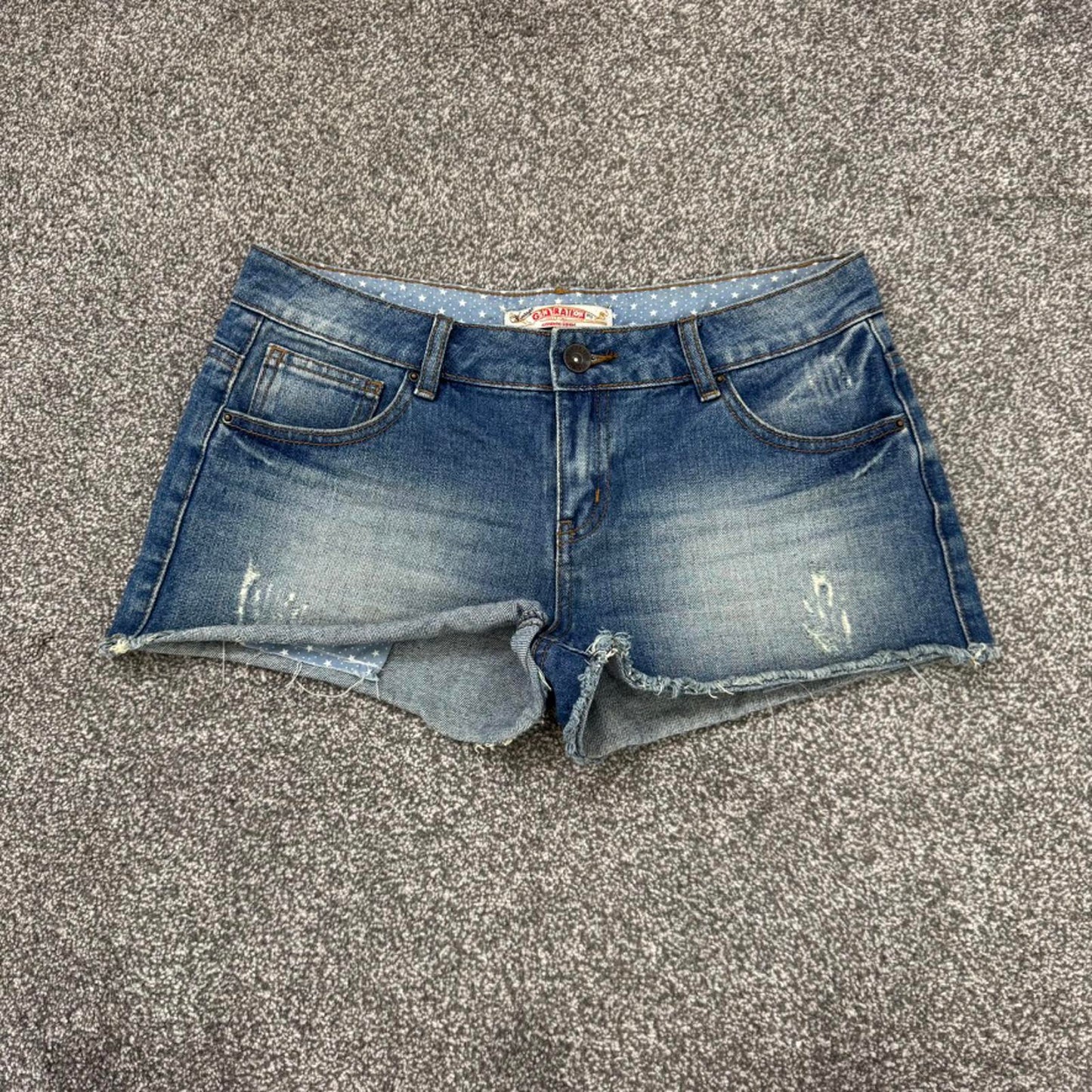 Y2K vintage mid rise denim mini shorts distressed ripped faded fraying hem stars