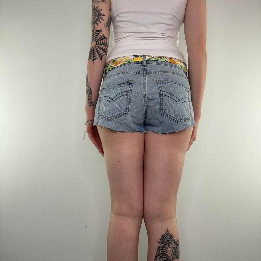 Y2K low rise raw hem mini denim shorts with sunflower tie belt