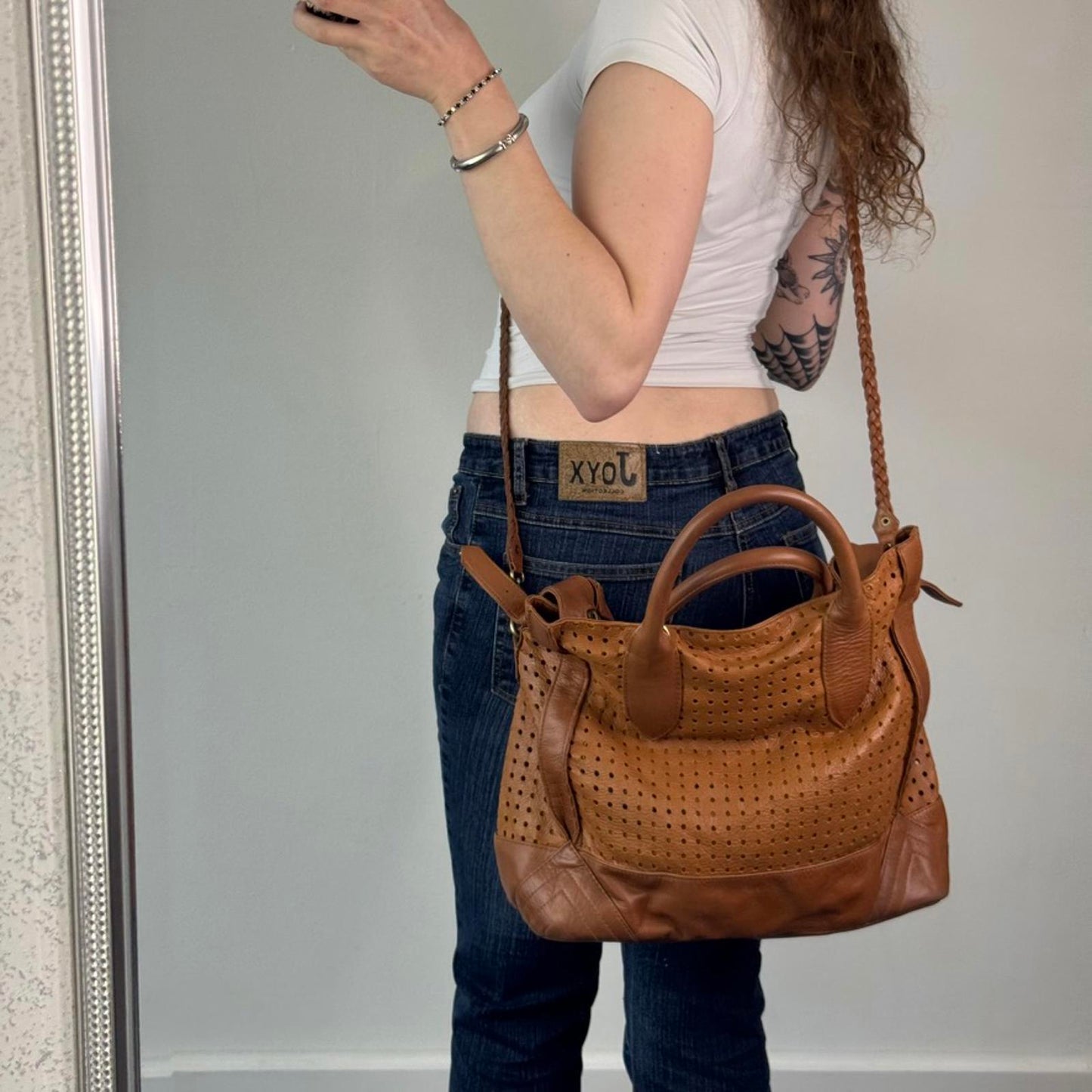 Oversized genuine perforated leather handbag braided strap large buckles boho