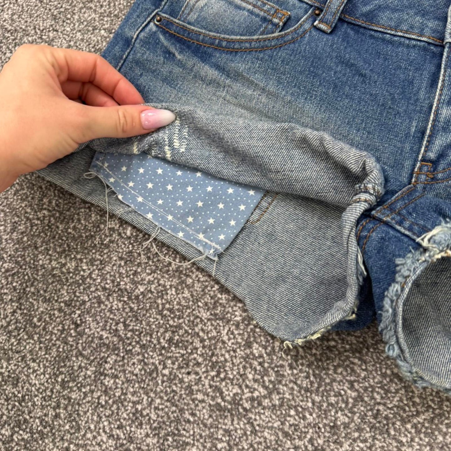 Y2K vintage mid rise denim mini shorts distressed ripped faded fraying hem stars