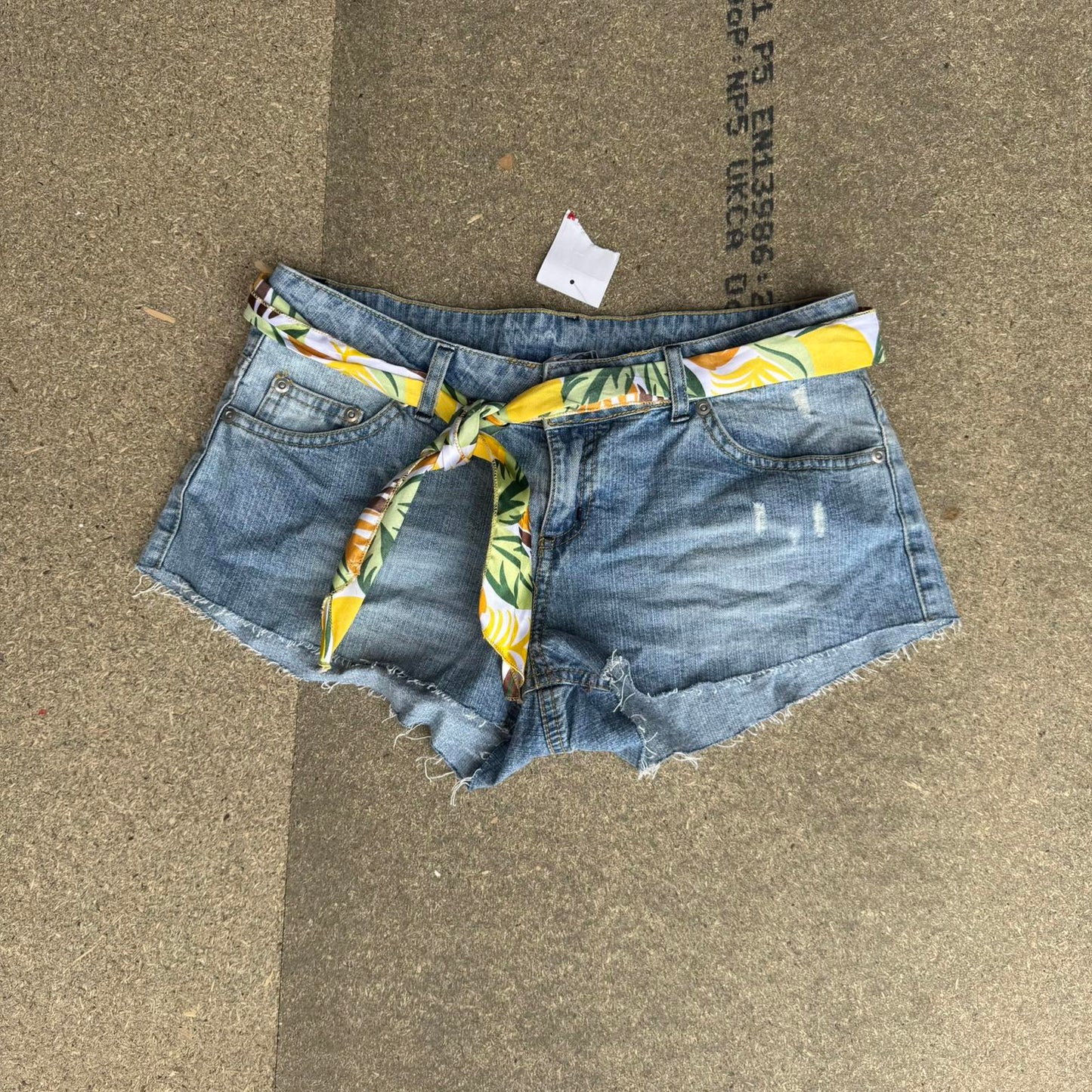 Y2K vintage low rise raw hem mini denim shorts with sunflower bow belt
