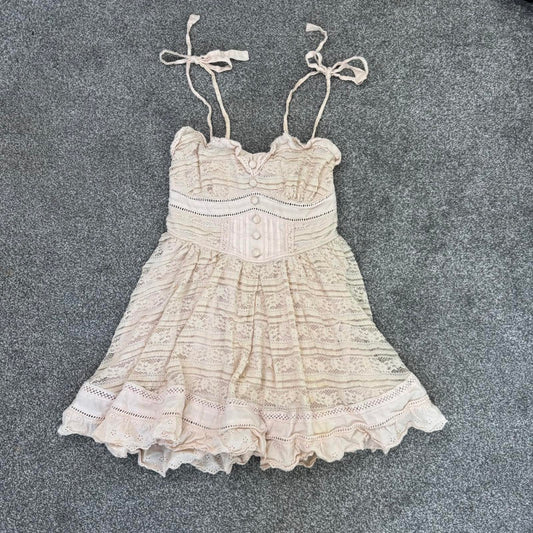 Japanese brand Liz Lisa coquette mini dress bows pink ruffle trim buttons lace