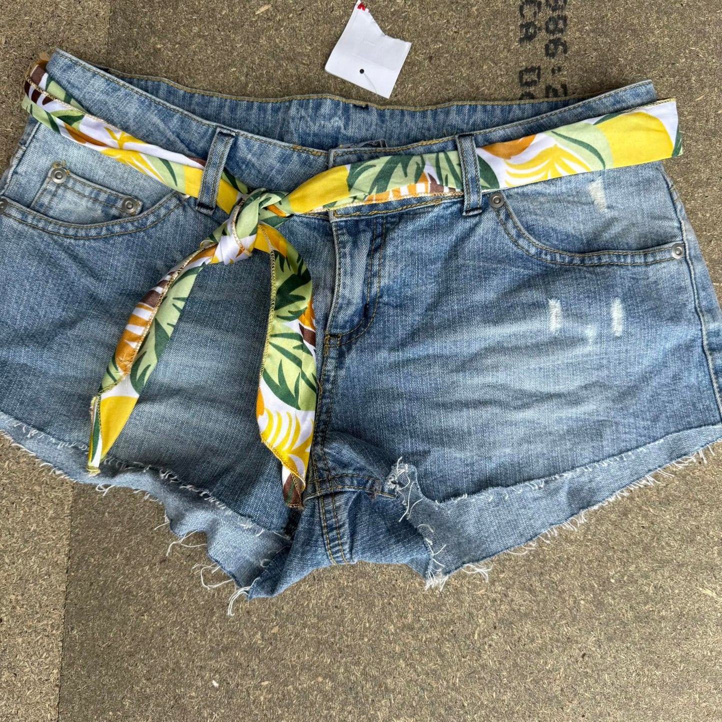 Y2K vintage low rise raw hem mini denim shorts with sunflower bow belt
