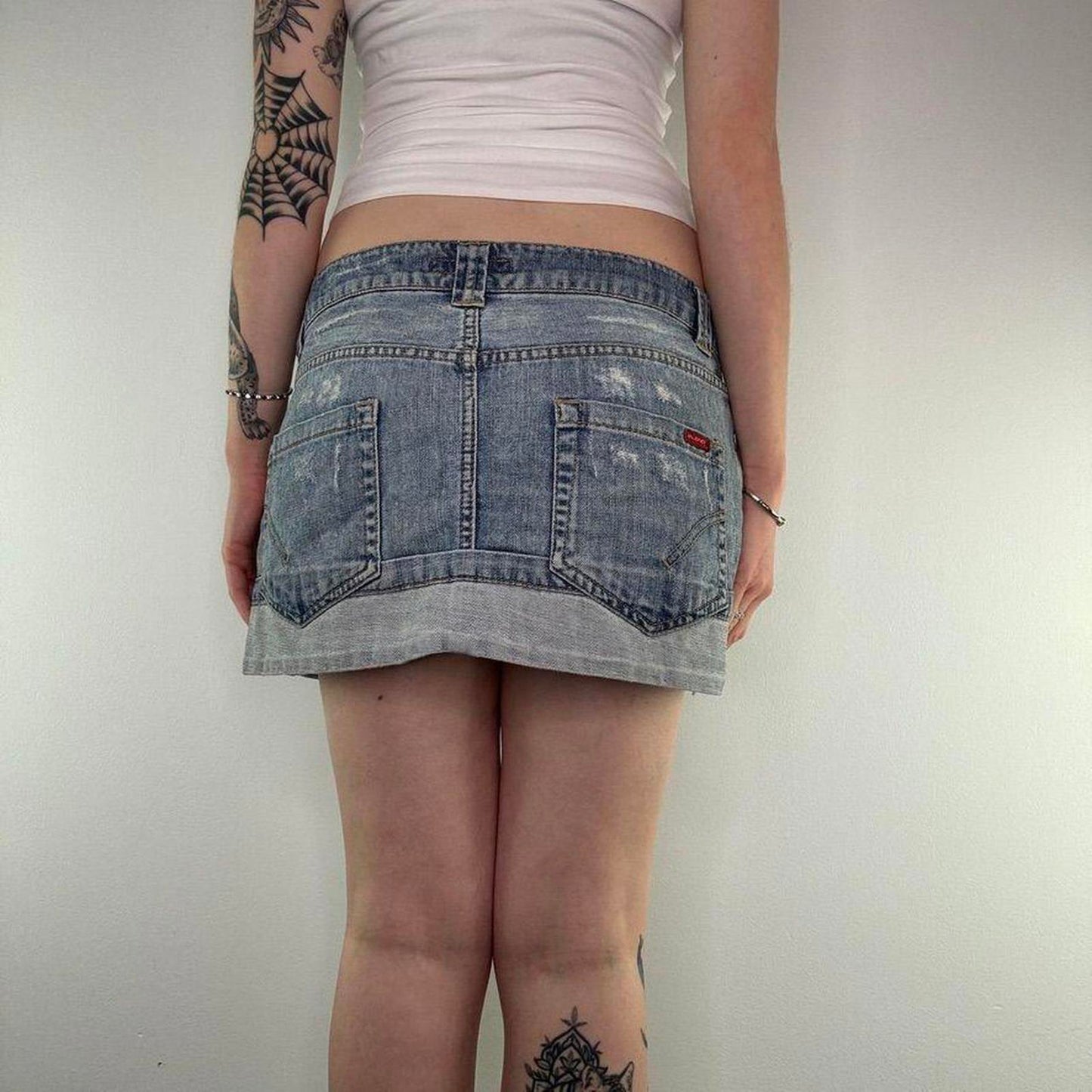 Y2K vintage low rise distressed denim two tone mini skirt light blue wash