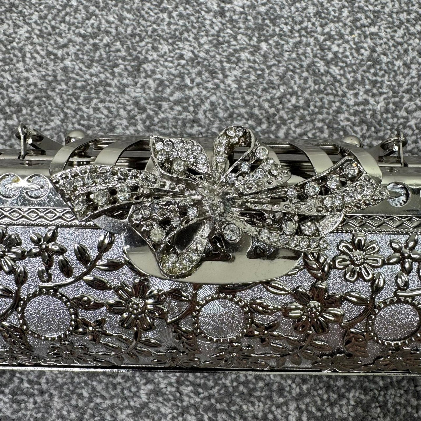 Silver tone ornate metal evening clutch bag with handle baguette long small