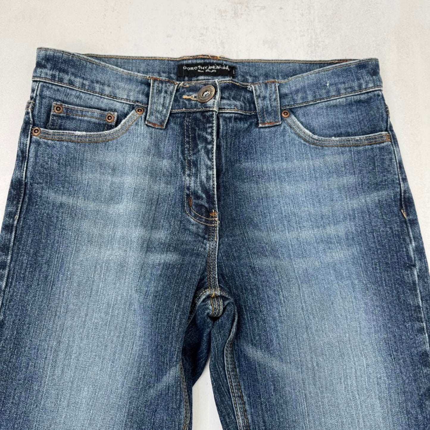 Y2K vintage bootcut denim jeans mid rise stretchy faded mid blue wash