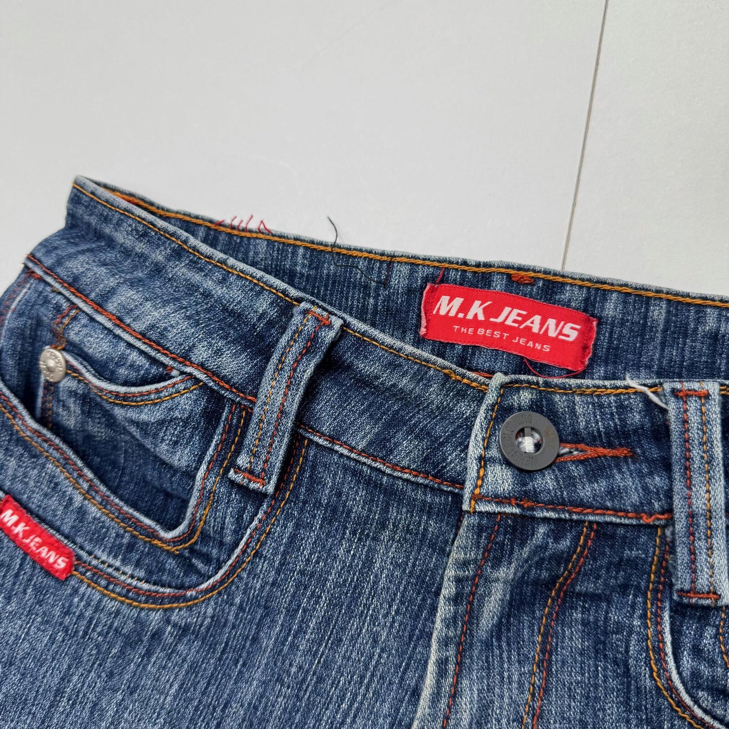 Y2K vintage bootcut denim jeans stretchy cargo pockets contrast stitch faded mid