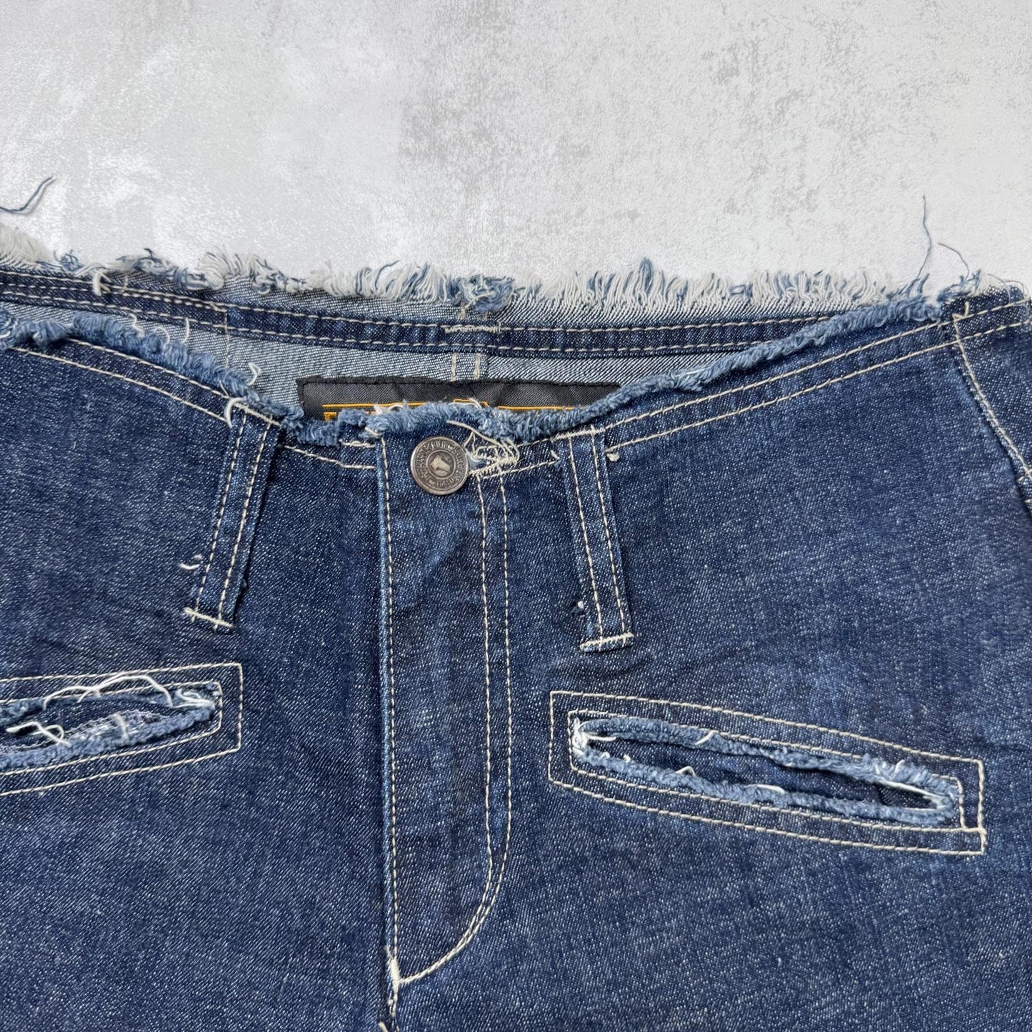 Y2K vintage low rise bootcut denim jeans zippers fraying hem dark blue wash