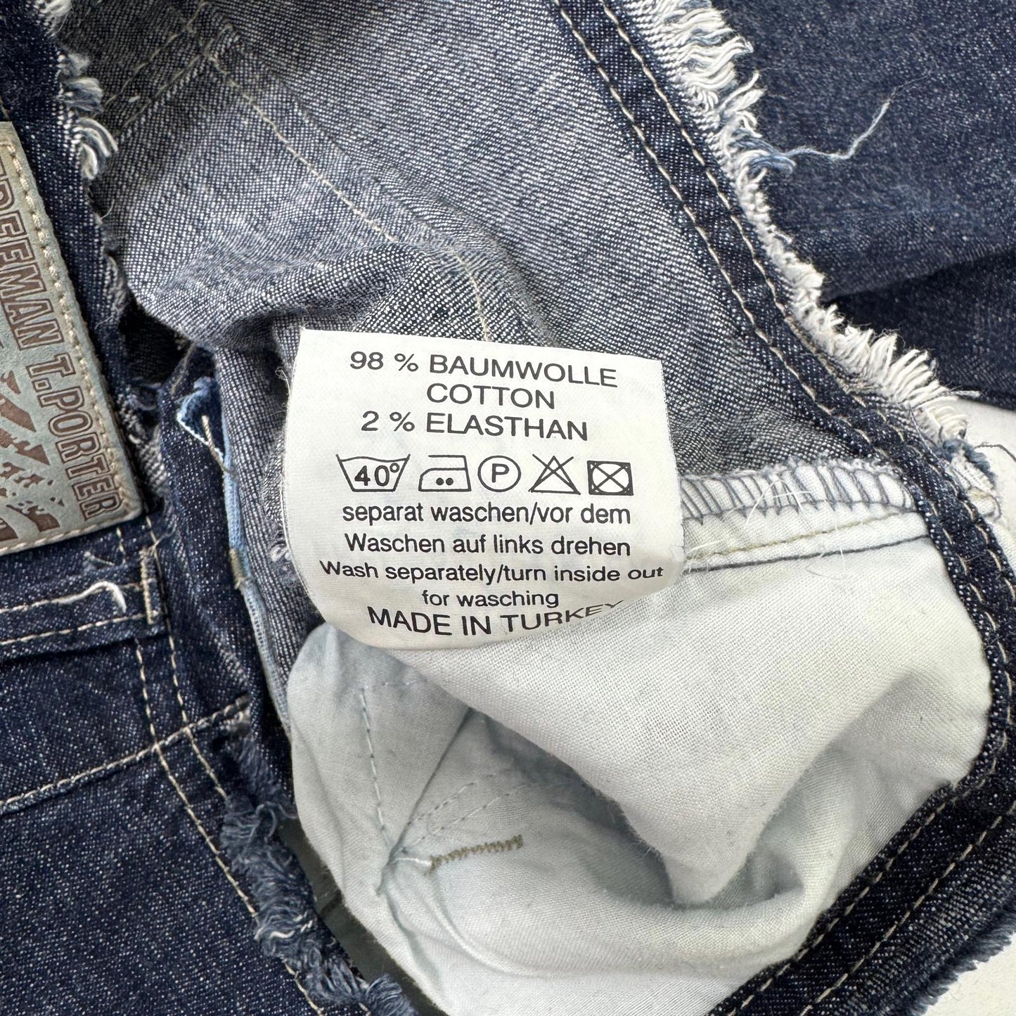 Y2K vintage low rise bootcut denim jeans zippers fraying hem dark blue wash