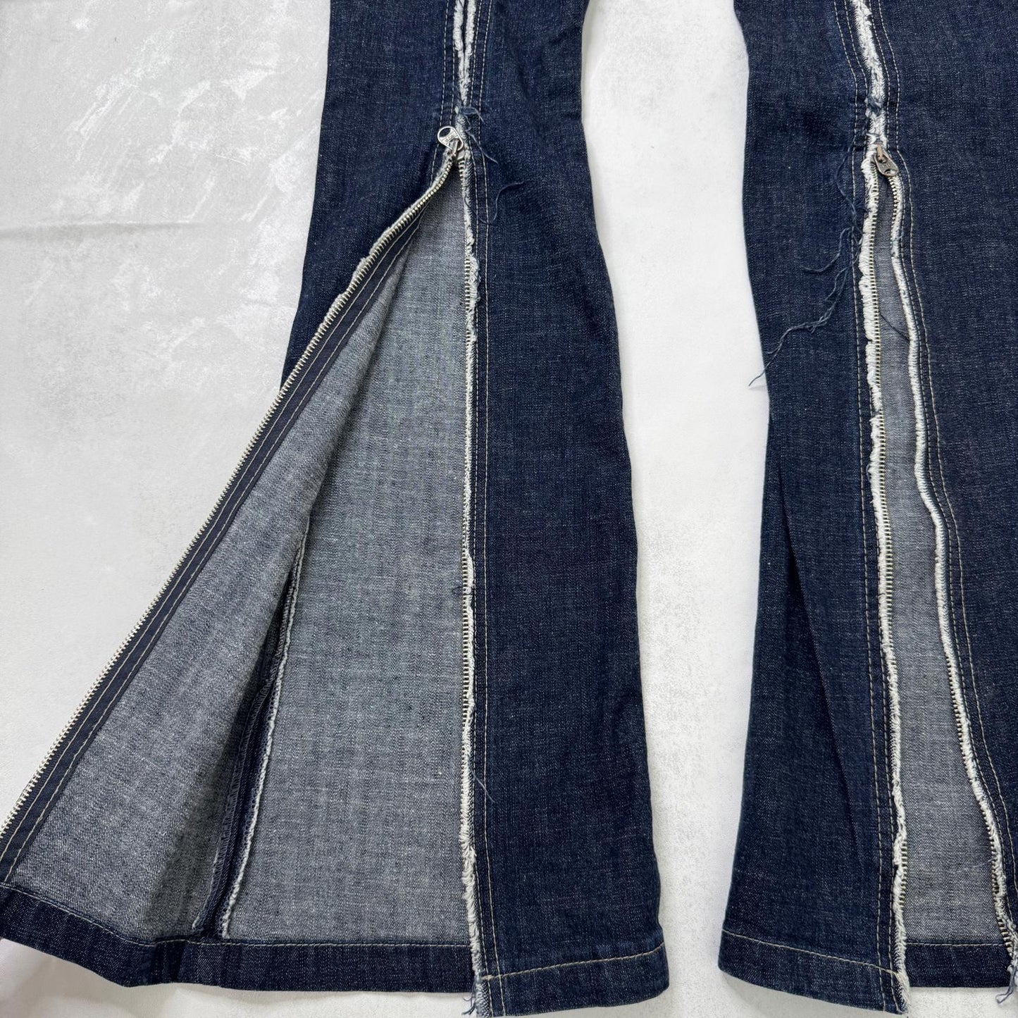 Y2K vintage low rise bootcut denim jeans zippers fraying hem dark blue wash
