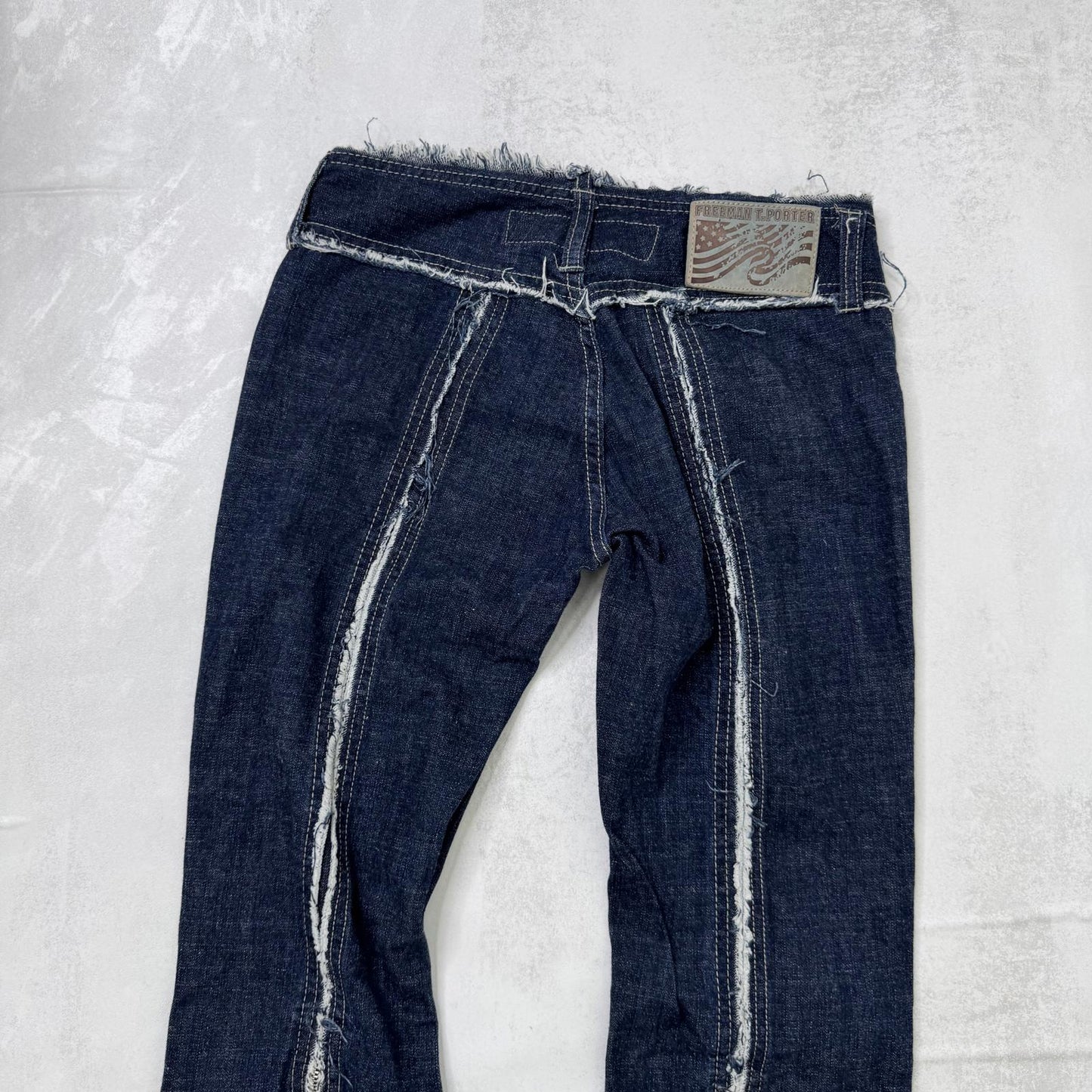 Y2K vintage low rise bootcut denim jeans zippers fraying hem dark blue wash