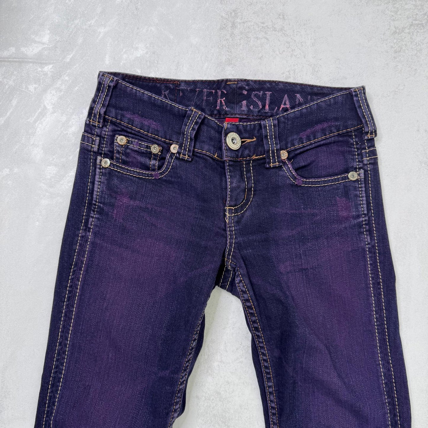 Y2K vintage low rise bootcut denim jeans stretchy purple faded wash fraying hem