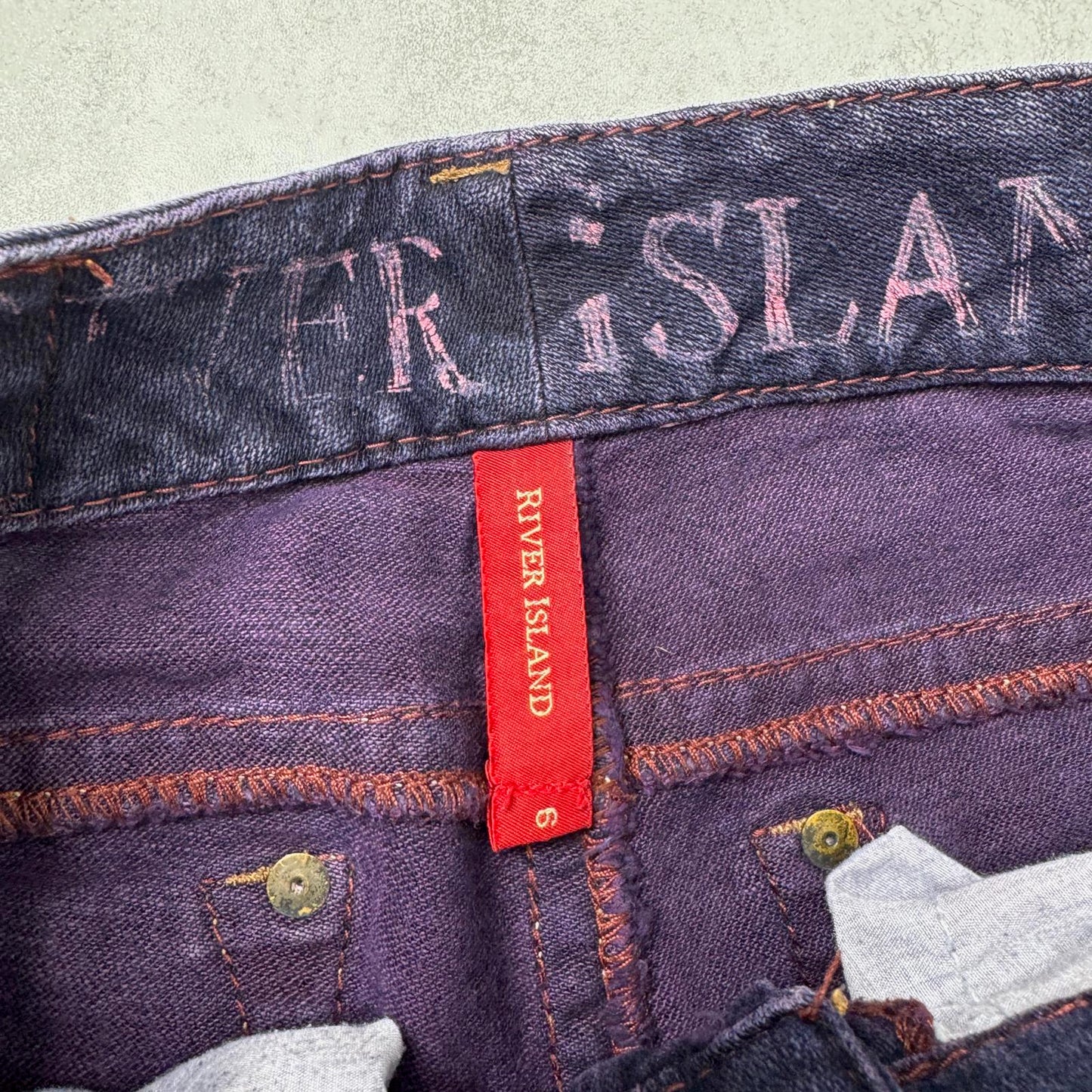 Y2K vintage low rise bootcut denim jeans stretchy purple faded wash fraying hem