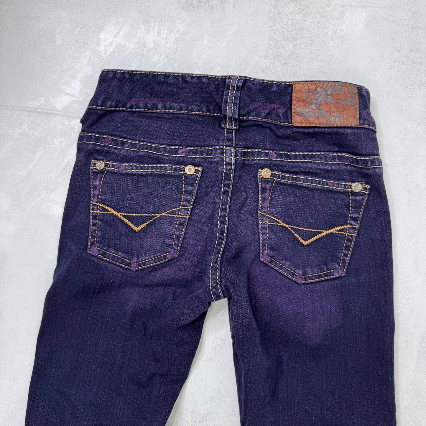 Y2K vintage low rise bootcut denim jeans stretchy purple faded wash fraying hem