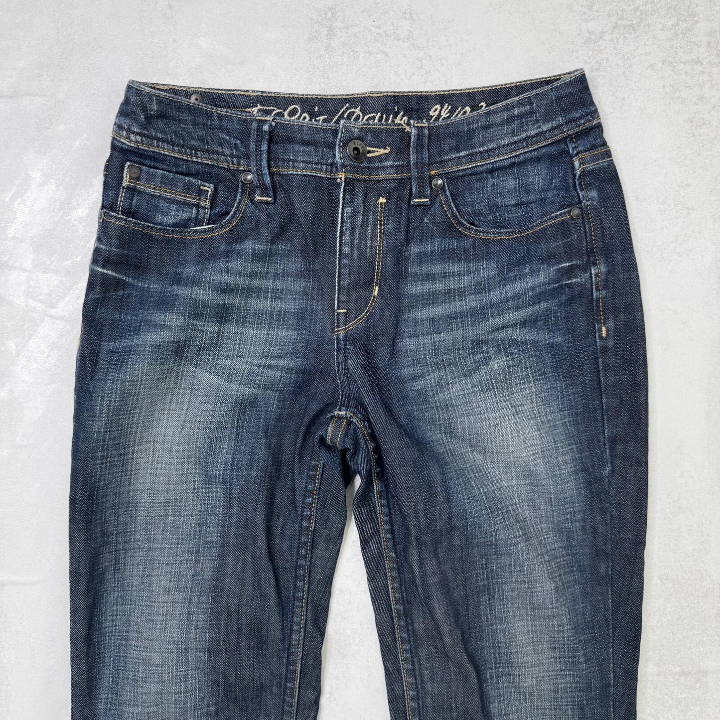 Y2K vintage bootcut denim jeans dark blue wash faded stretch mid rise