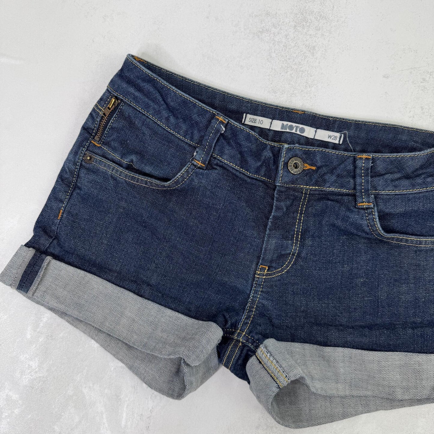 Y2K vintage denim mini shorts low rise stretchy dark blue wash turn up hem