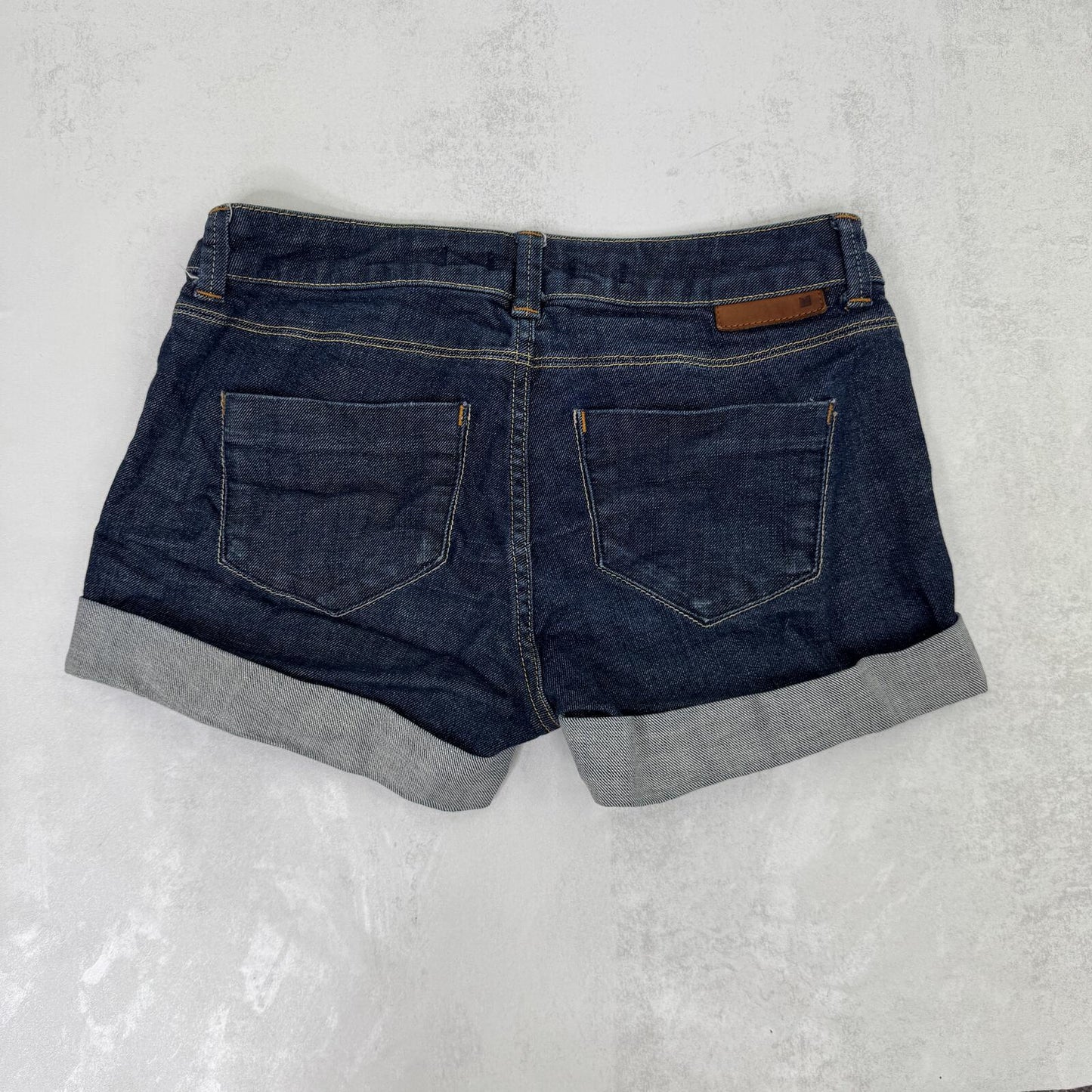 Y2K vintage denim mini shorts low rise stretchy dark blue wash turn up hem