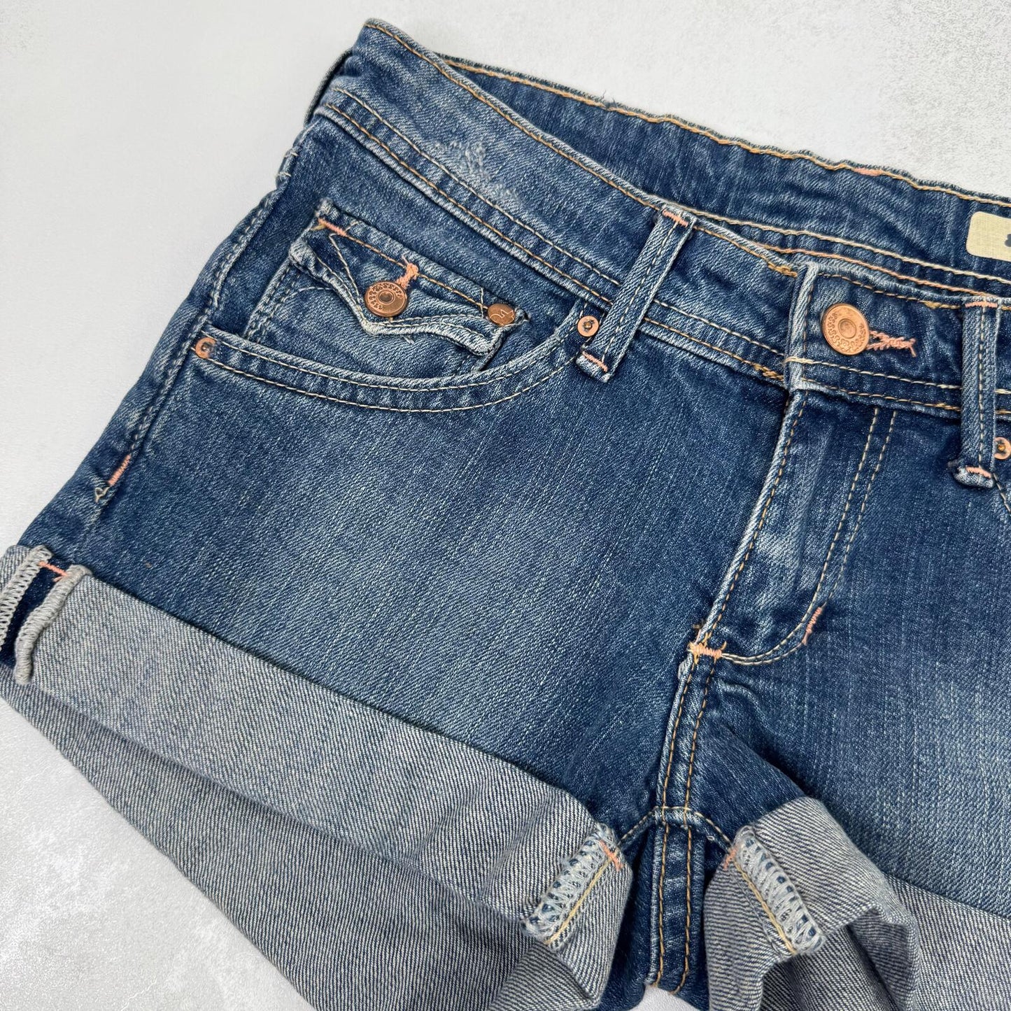 Y2K vintage low rise denim mini shorts cargo turn up hem faded blue stretchy
