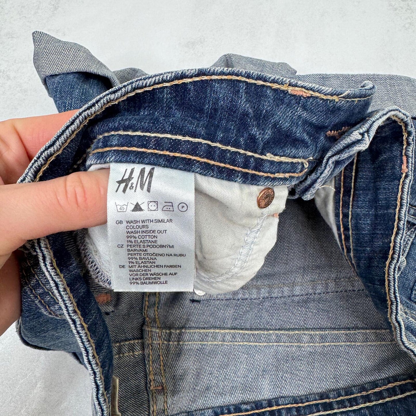 Y2K vintage low rise denim mini shorts cargo turn up hem faded blue stretchy