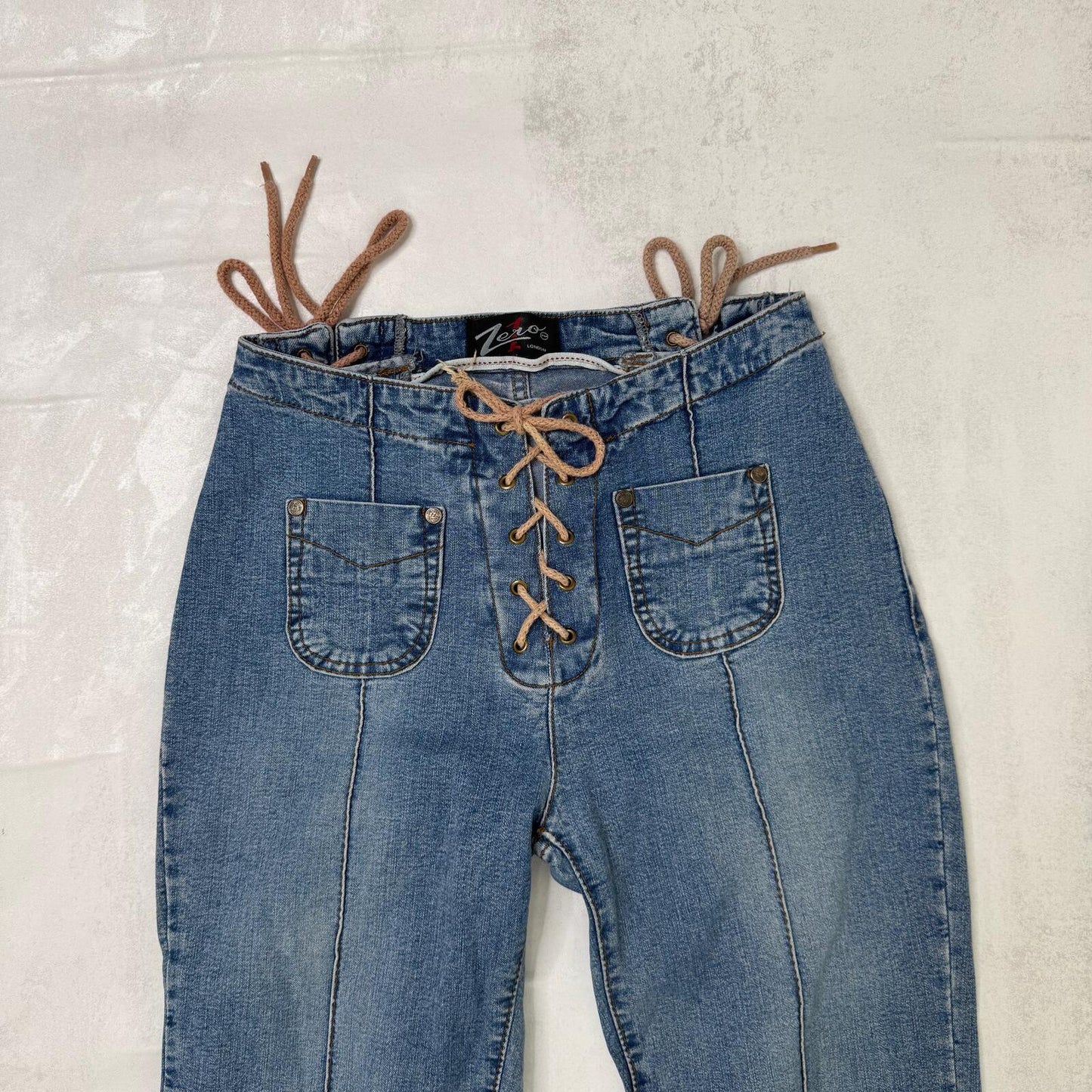 Y2K vintage bootcut denim jeans faded mid rise stretchy lace up mid blue wash