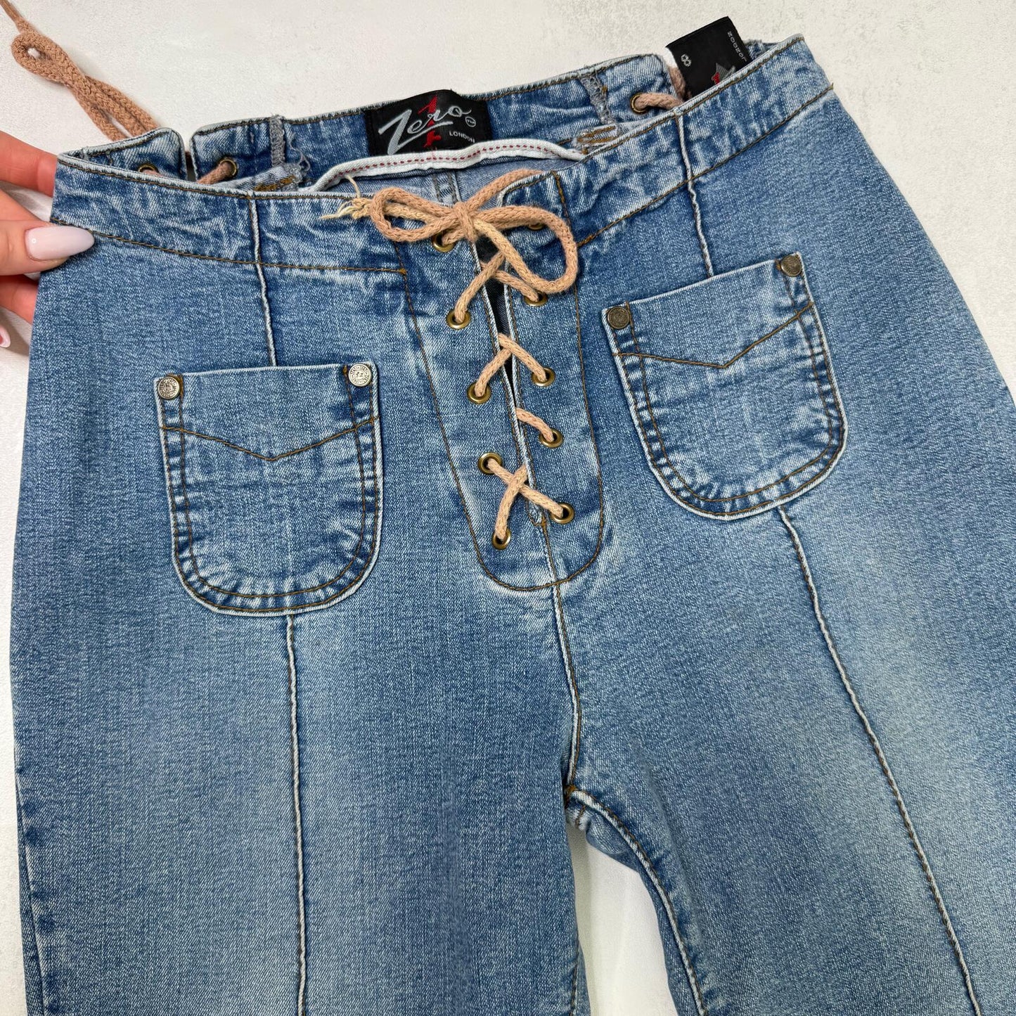 Y2K vintage bootcut denim jeans faded mid rise stretchy lace up mid blue wash