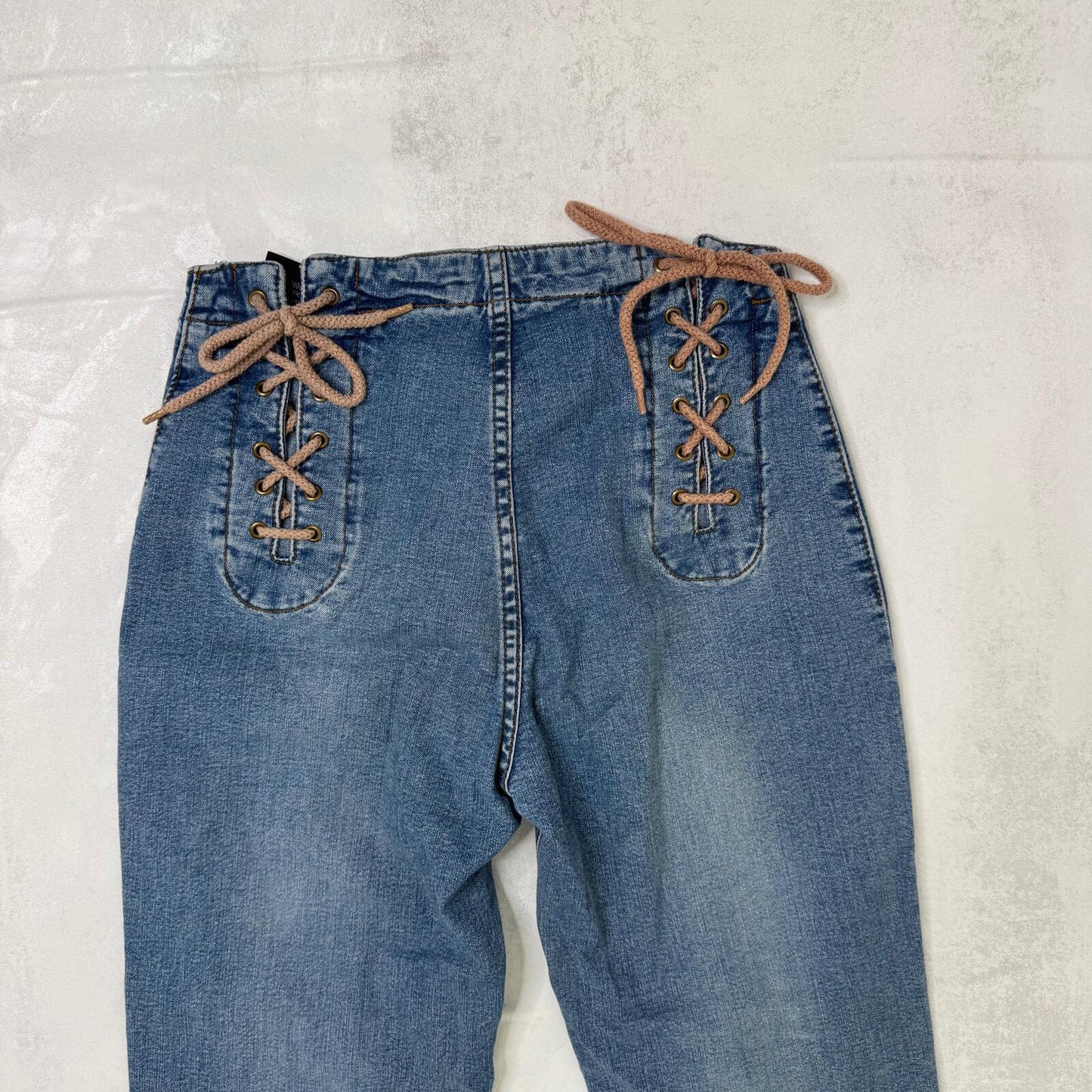 Y2K vintage bootcut denim jeans faded mid rise stretchy lace up mid blue wash