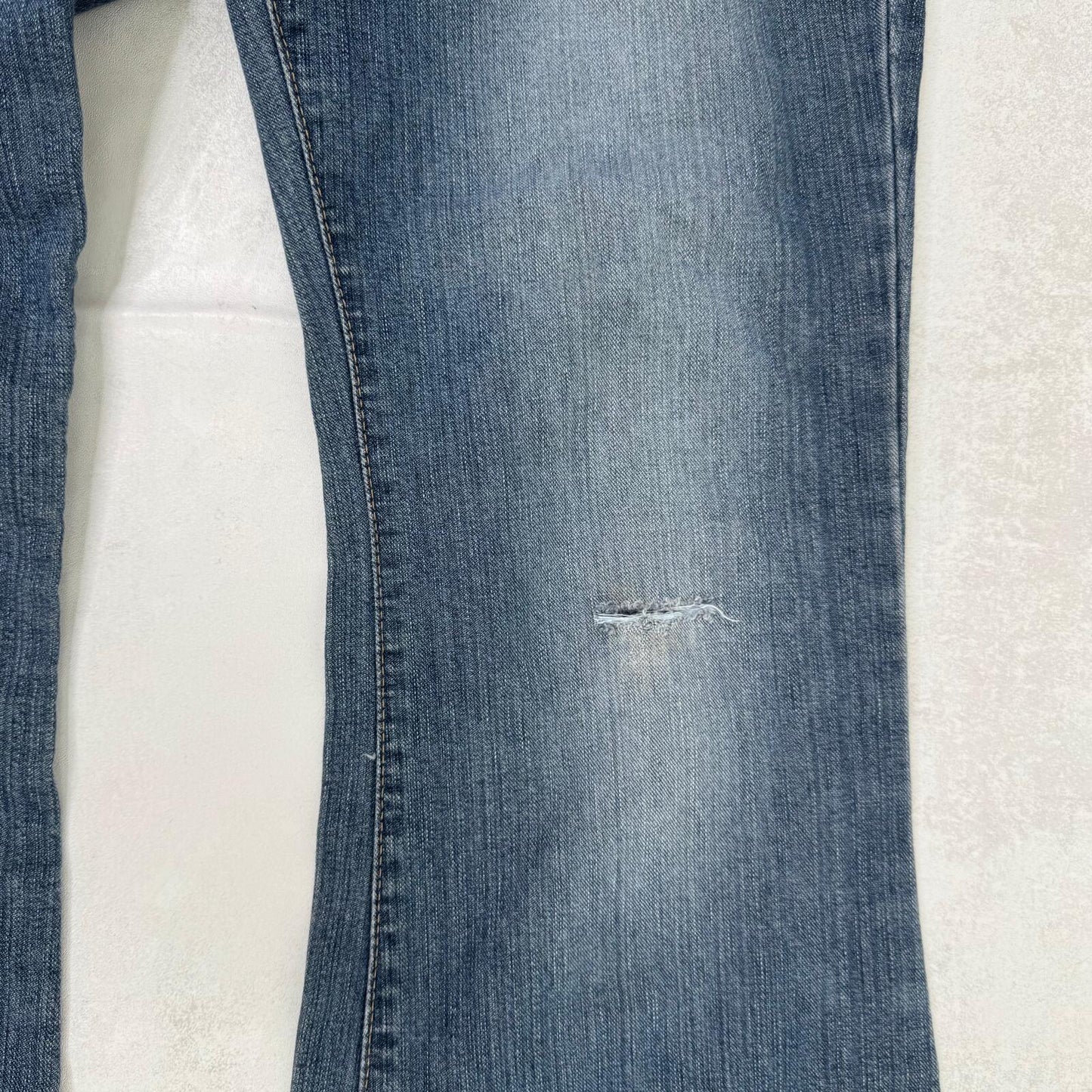 Y2K vintage bootcut denim jeans buckle belt faded blue wash ripped distressed