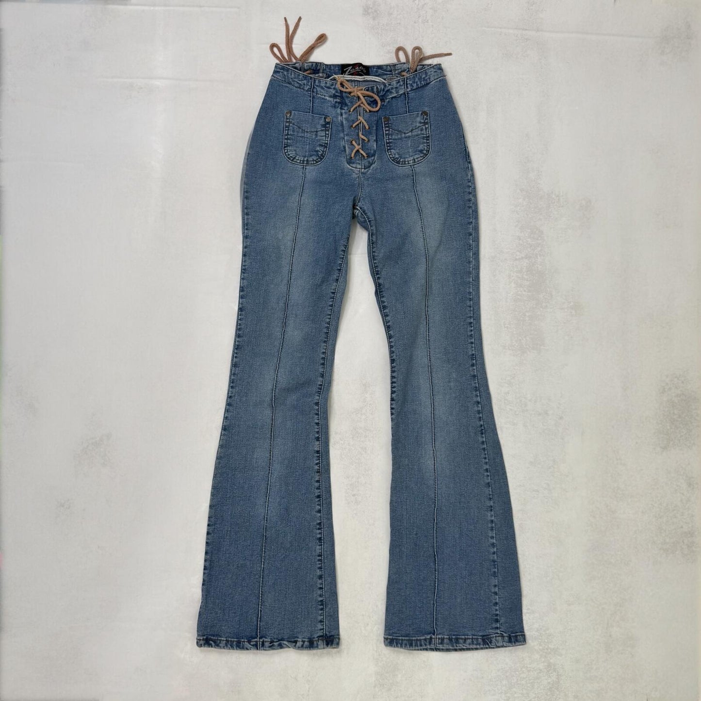 Y2K vintage bootcut denim jeans faded mid rise stretchy lace up mid blue wash