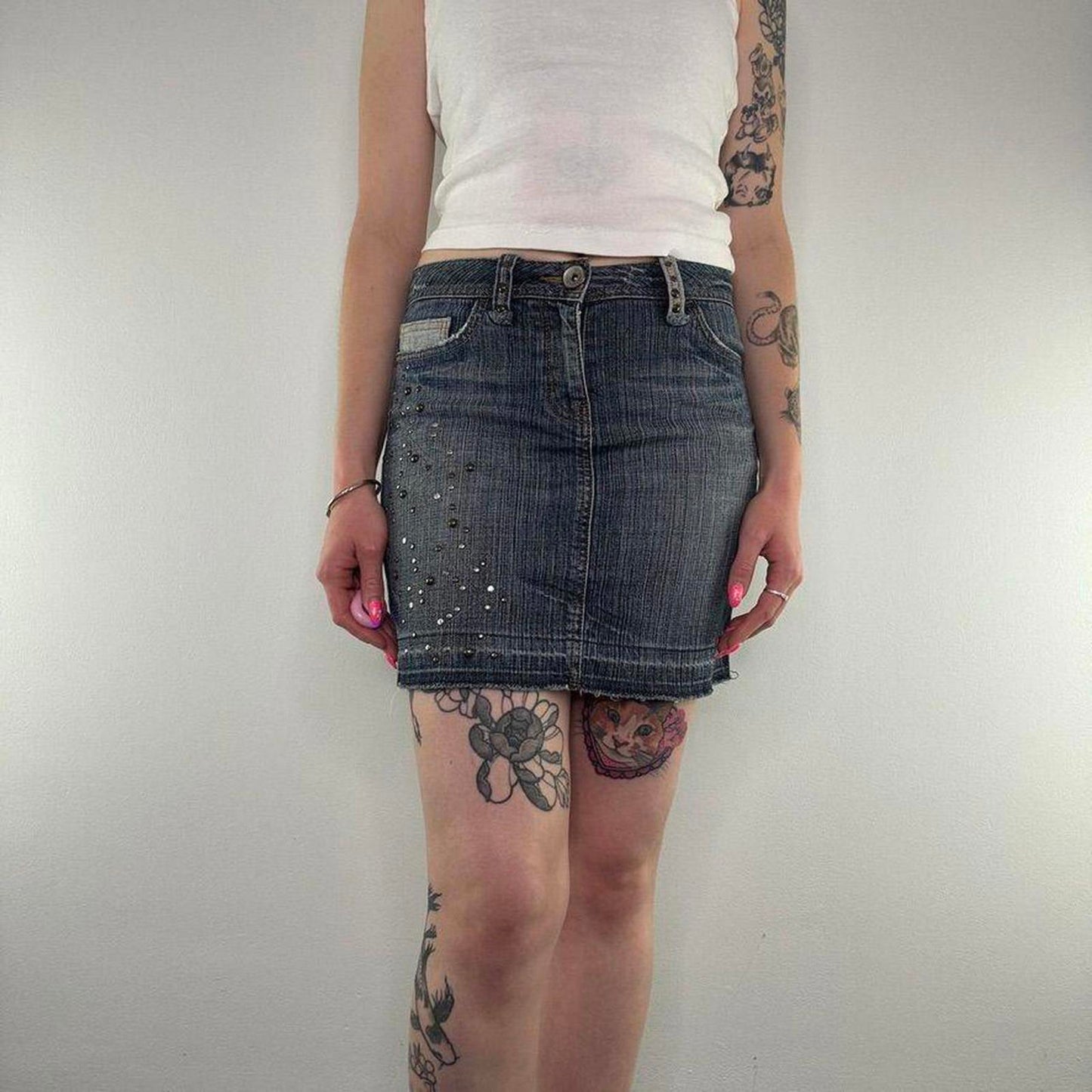 Y2K vintage studded mini skirt faded denim fraying hem embellished dark blue