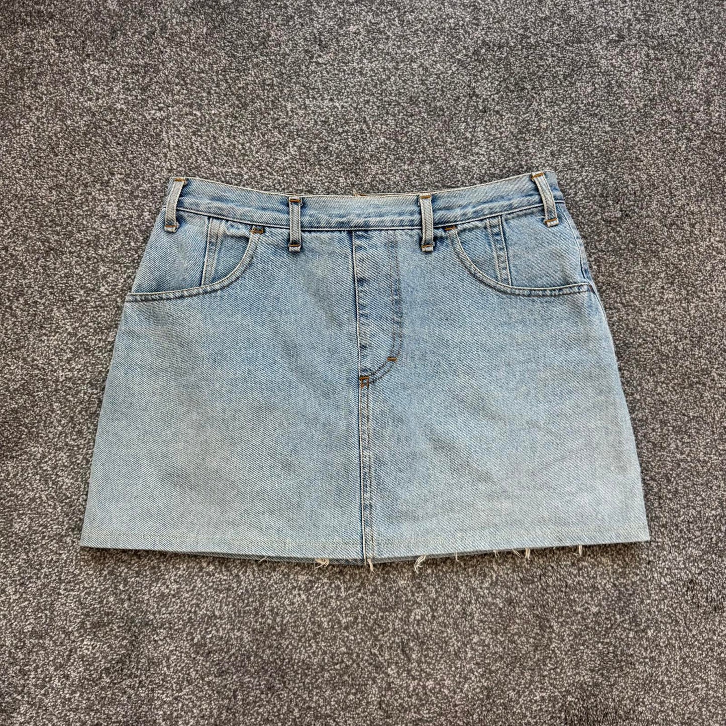 90s Y2K vintage denim mini skirt zipper fraying hem light blue wash mid rise