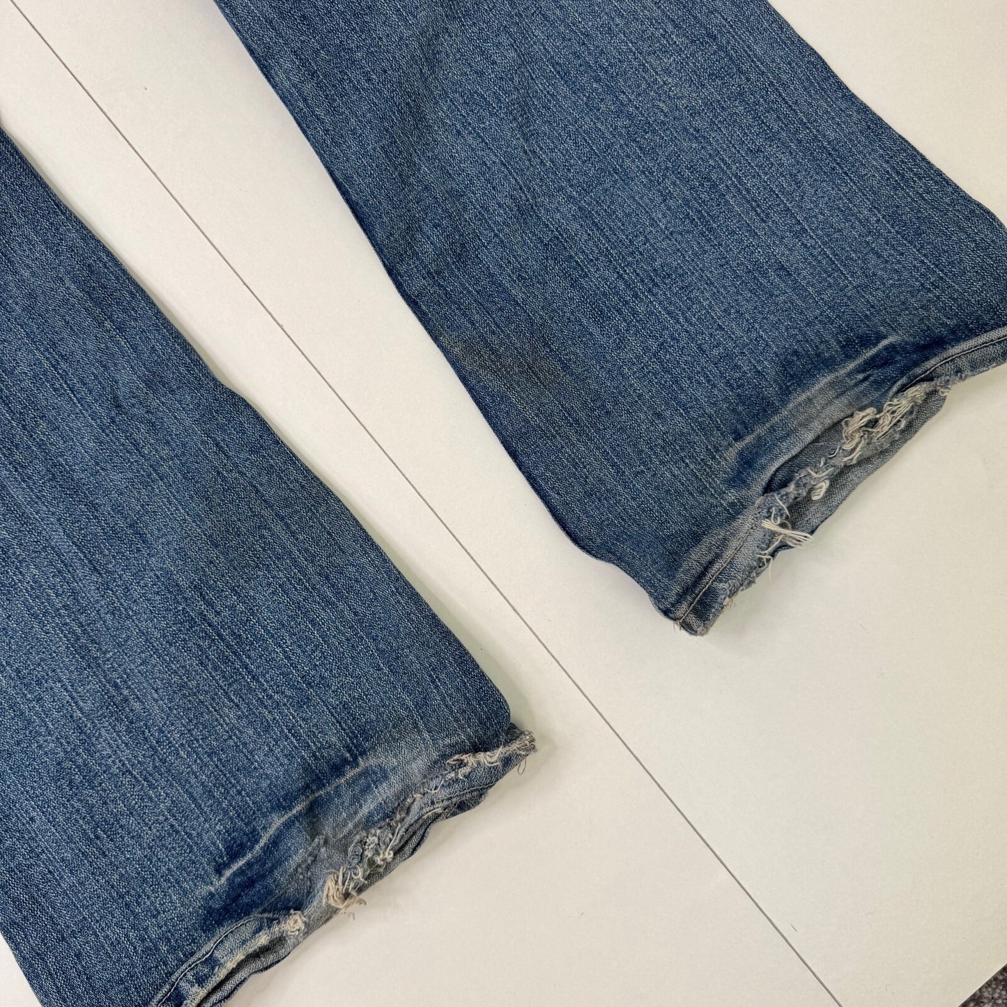 Y2K vintage bootcut denim jeans stretchy faded mid blue distressed
