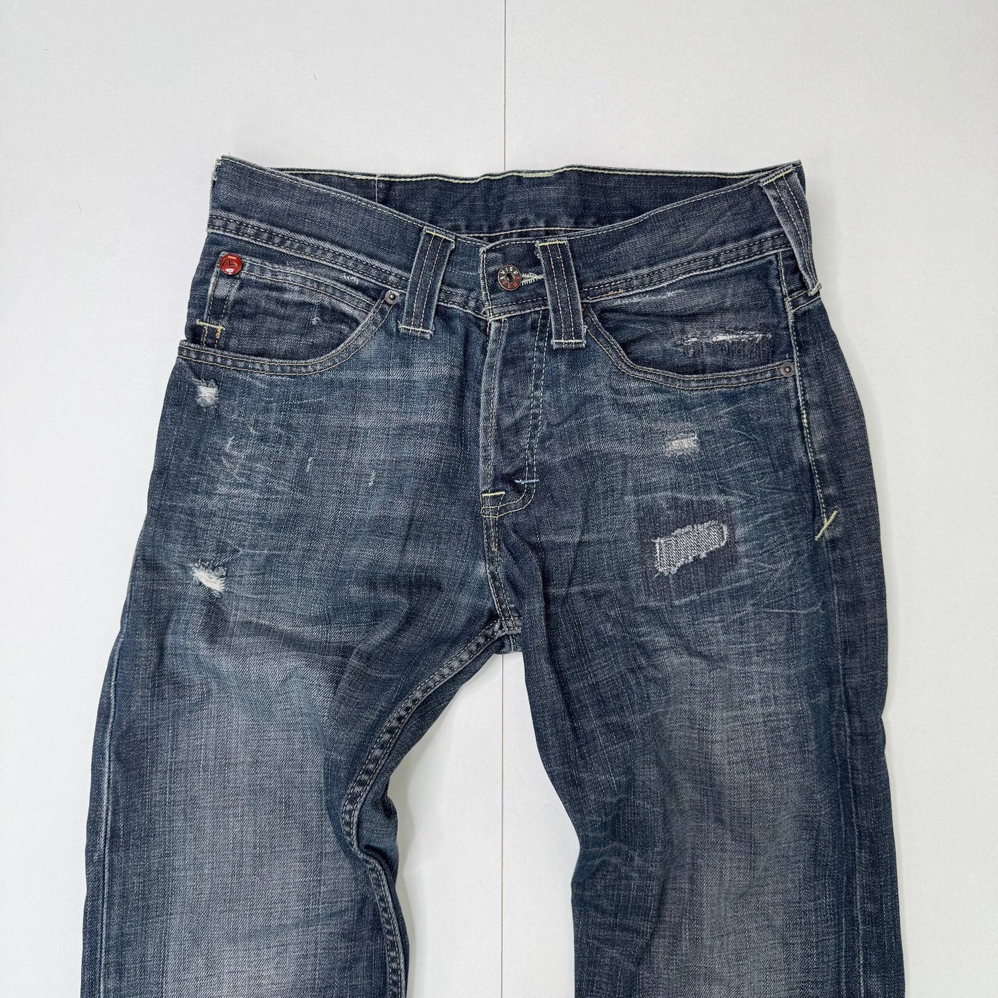 Y2K vintage Evisu x Puma bootcut jeans dark faded denim wash distressed