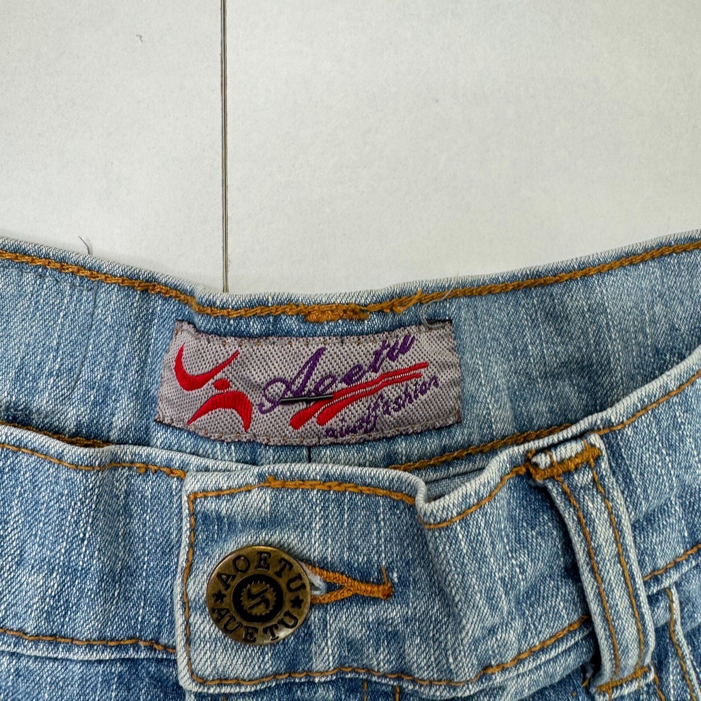 Y2K vintage bootcut denim jeans cut out beaded floral pattern light blue wash