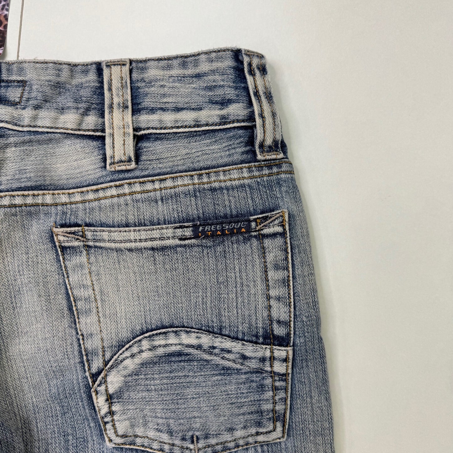 Y2K vintage low rise bootcut denim jeans faded distressed stripe wash