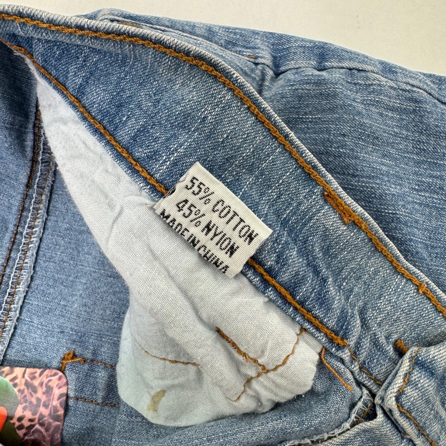 Y2K vintage bootcut denim jeans cut out beaded floral pattern light blue wash